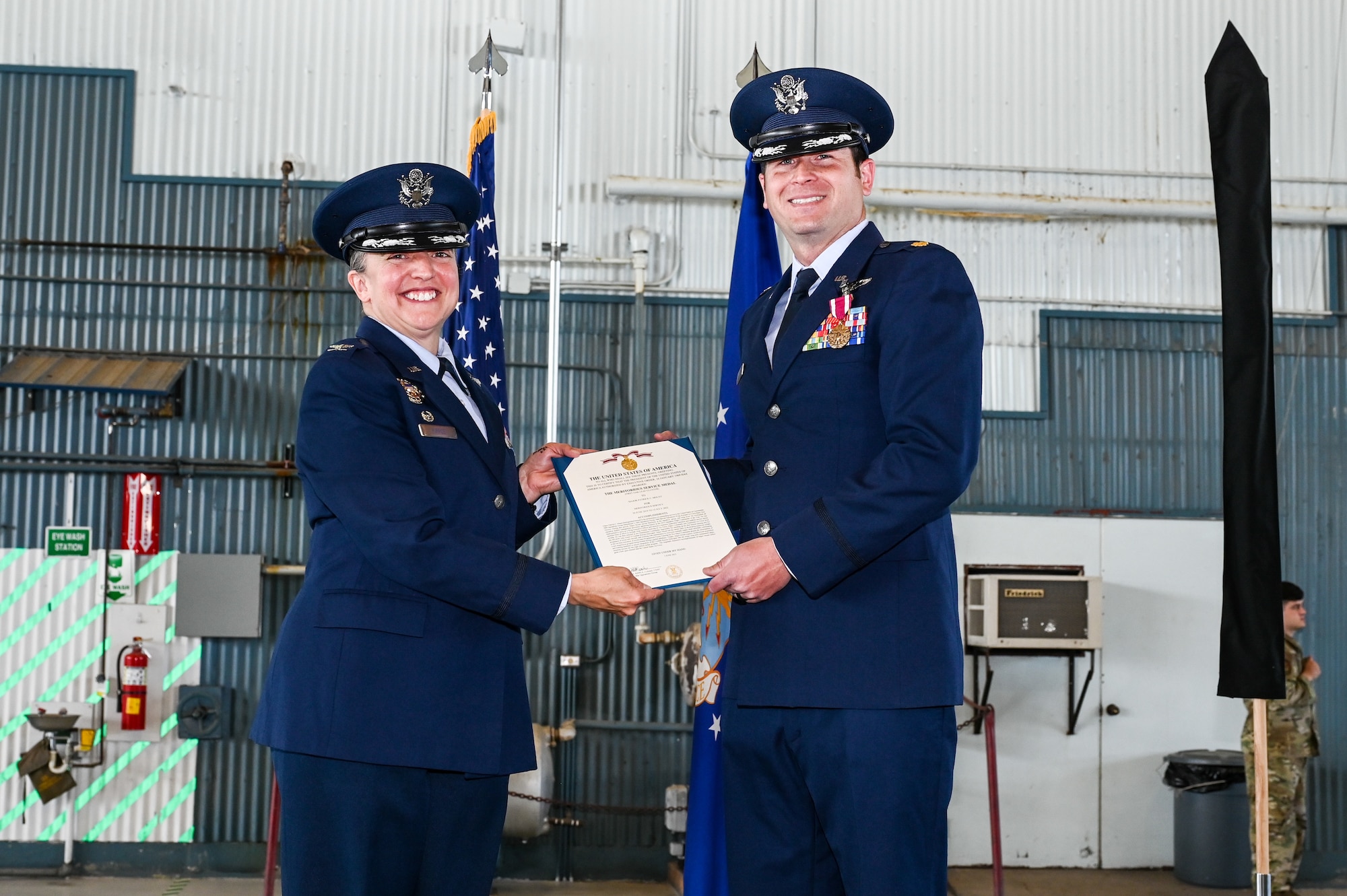 Airmen pose for photo.