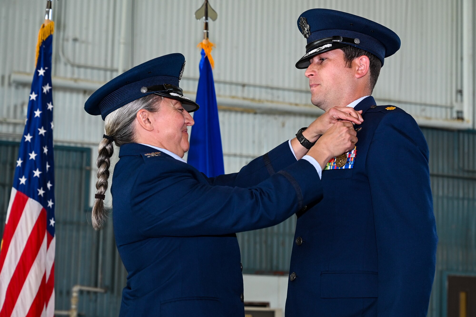 Airman pins other airman.