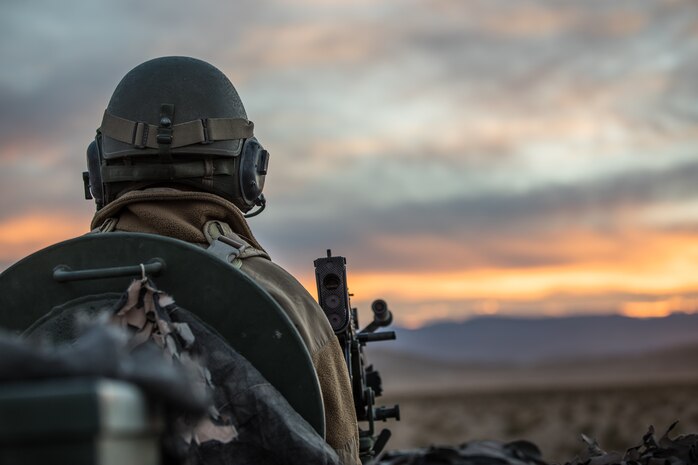 U.S. Marine Corps Staff Sgt. Daniel Davis, an infantry unit leader with Headquarters platoon, B Co., 3rd Light Armored Reconnaissance Battalion, 1st Marine Division, holds a defensive position in a light armored vehicle during exercise Steel Knight/Dawn Blitz 21 (SK/DB) 21 at Marine Air Ground Combat Center Twentynine Palms, California, Dec. 8, 2020. Exercise SK/DB 21 provides effective and intense training in an expeditionary environment to ensure 1st Marine Division remains lethal, combat-ready, interoperable, and deployable on short notice. (U.S. Marine Corps photo by Lance Cpl. Quince Bisard)