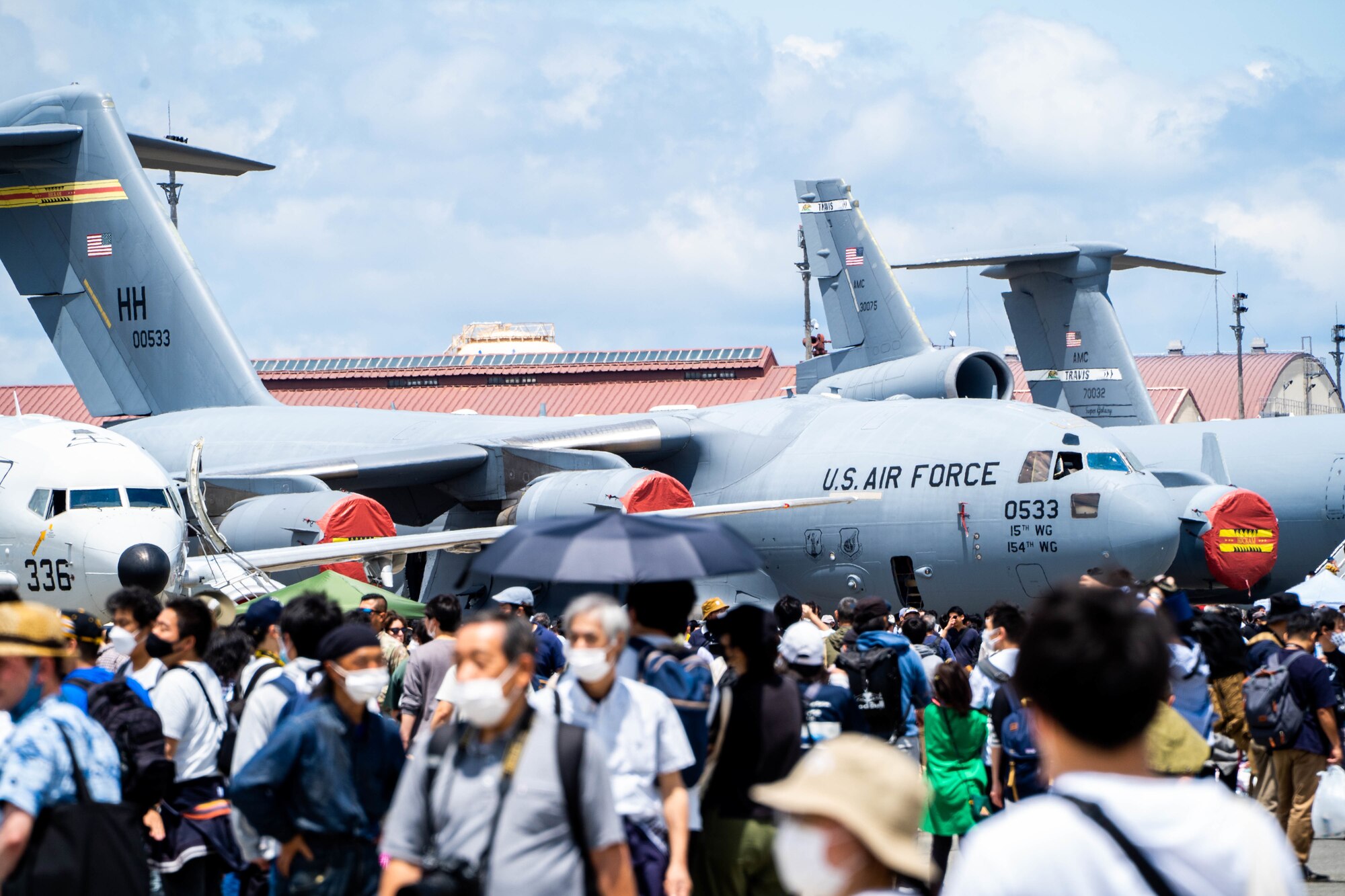 Festival guests tour static displays of different types of aircrafts at the Friendship Festival 2022 at Yokota Air Base, May 22, 2022. The event embodied the true spirit of friendship, welcoming more than 110,000 Japanese neighbors, sharing our cultures through food, music, and performances. (U.S. Air Force photo by Airman 1st Class Makensie Cooper)