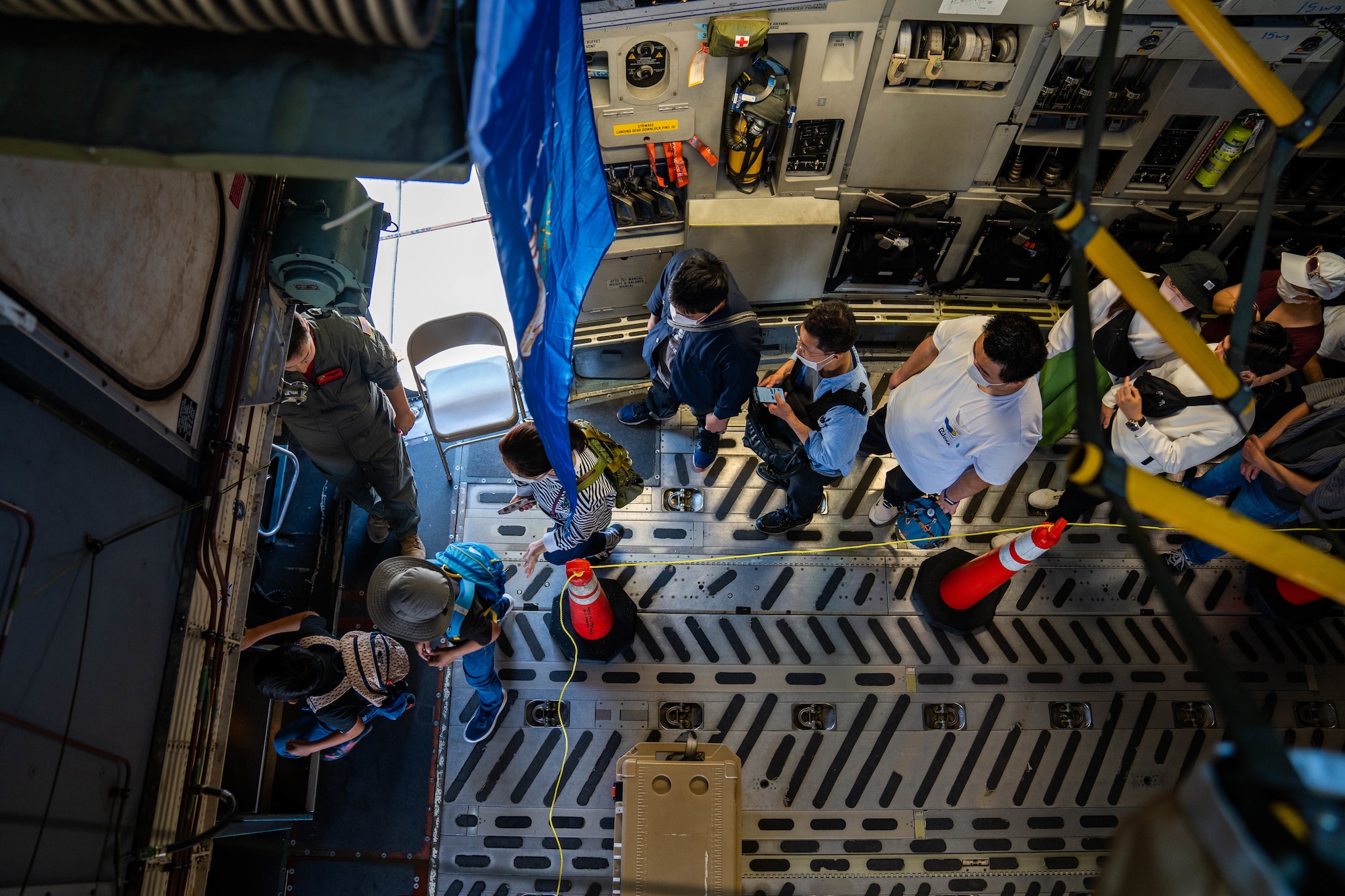Festival guests tour the inside of a C-17 Globemaster III during the Friendship Festival 2022 at Yokota Air Base, Japan, May 22, 2022. The festival embodied the true spirit of friendship, welcoming more than 110,000 Japanese neighbors to meet with our Airmen and tour static displays of U.S and Japanese Aircraft while sharing our cultures and stories. (U.S. Air Force photo by Airman 1st Class Makensie Cooper)
