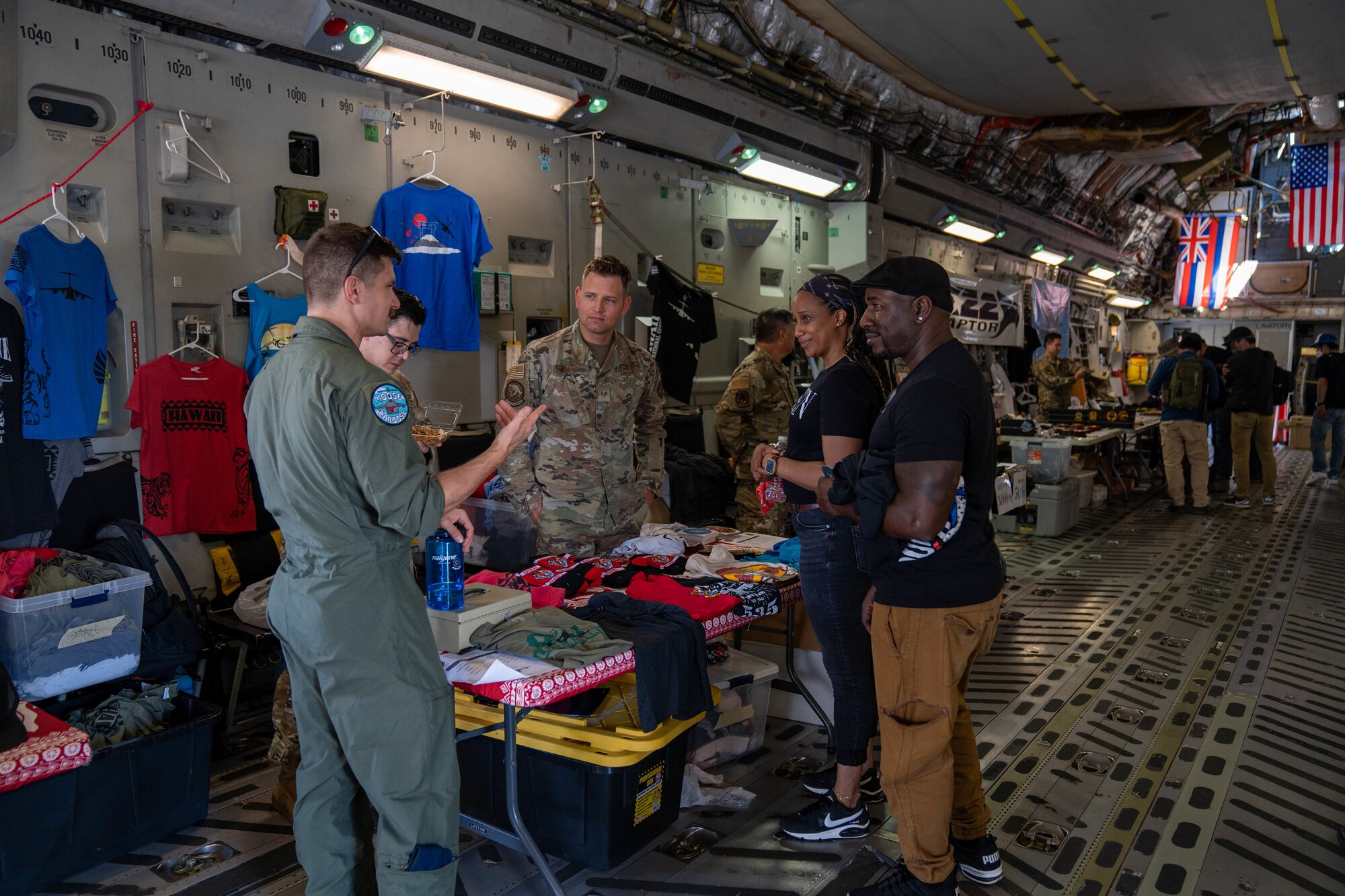 Festival guests interact with Airmen assigned to the 15th Wing and look at the memorabilia on display during the Friendship Festival 2022 at Yokota Air Base, Japan, May 22, 2022. The festival was an opportunity for visitors to learn and celebrate the partnership between the U.S. and Japan, while strengthening the bonds between Yokota and the local communities. (U.S. Air Force photo by Airman 1st Class Makensie Cooper)