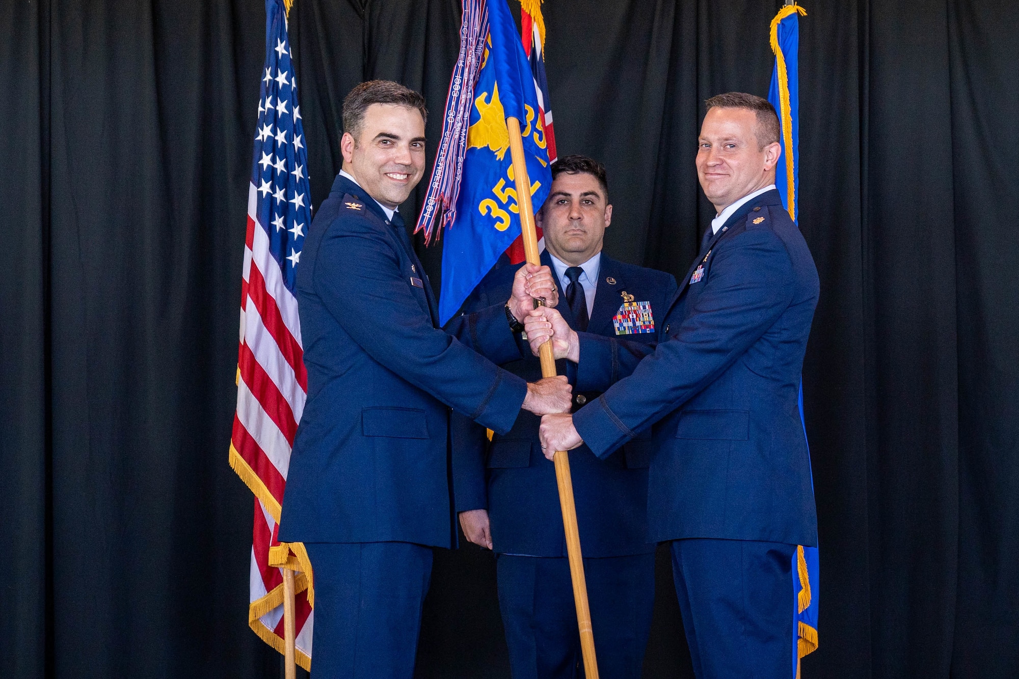 Lt. Col. Domenic Magazu III, ​​ assumes command of the 352d Cyberspace Operational Squadron by accepting the guidon from Col. John Picklesimer, 67th Cyberspace Operations Group commander during a Change of Command Ceremony at Joint Base Pearl Harbor-Hickam, Hawaii, June 1 2022. The 352d COS acts as the Air Forces Cyber execution arm for conducting global cyberspace operations, providing organic operations training, cyber capability development, operations testing, and range capabilities to drive readiness across the Cyber Mission Force. (U.S. Air Force photo by Airman 1st Class Makensie Cooper)