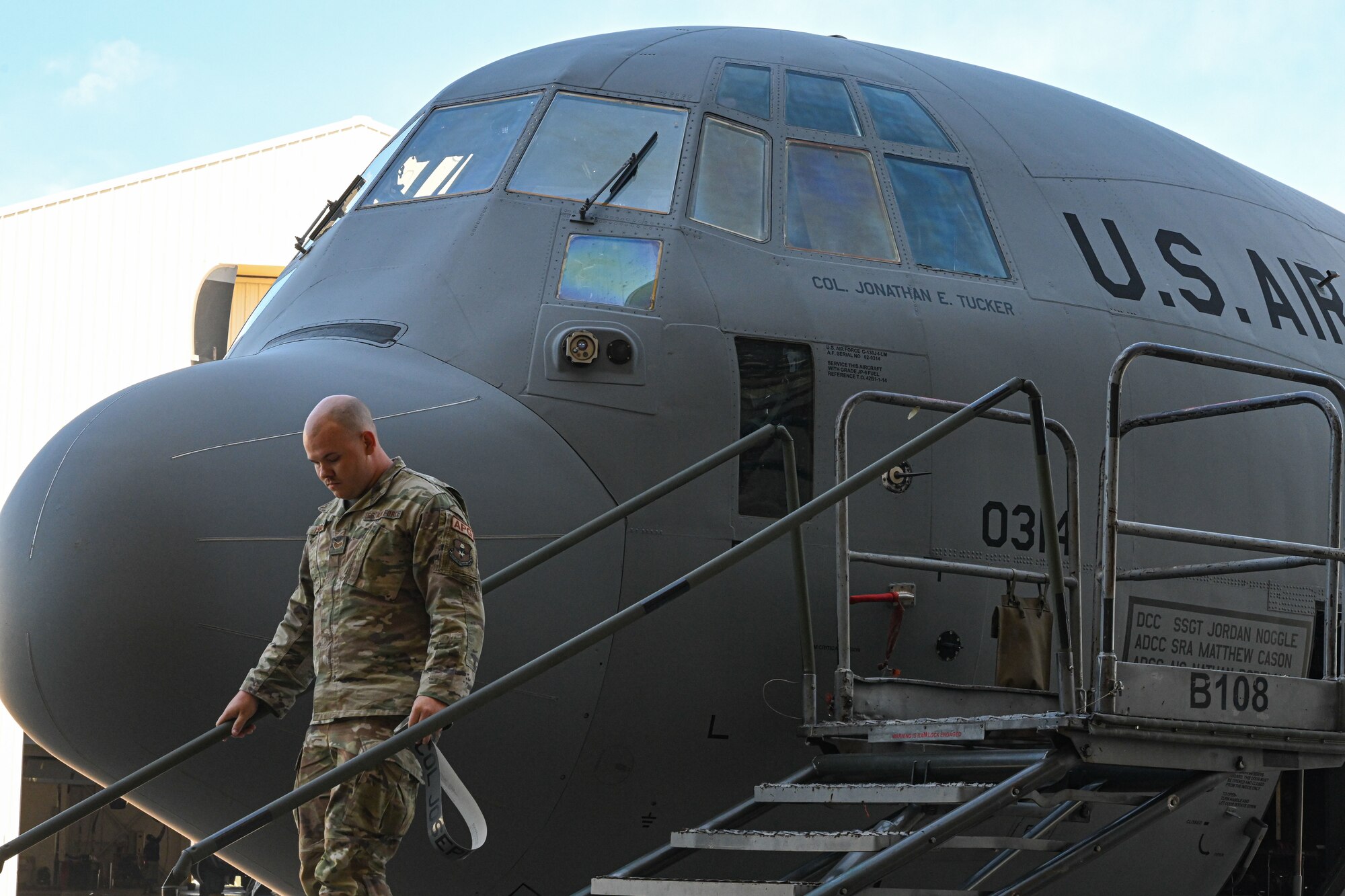 The name of Col. Jonathan Tucker, 314th Airlift Wing commander, is unveiled on C-130J Super Hercules