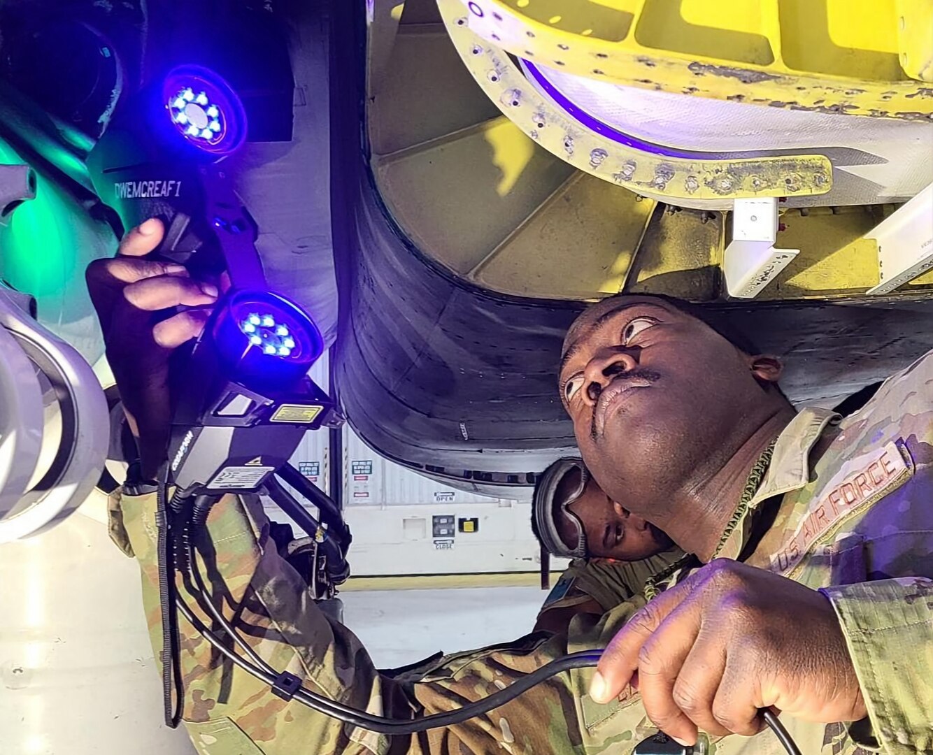 Tech. Sgt. James Bell, 7th Equipment Maintenance Squadron Aircraft Metals Technology craftsman, uses new scanning equipment to scan an image of a small part on a B-1B Lancer at Dyess Air Force Base, Texas. The scanner is part of new 3D printer technology used to fabricate new aircraft parts. (Courtesy photo)