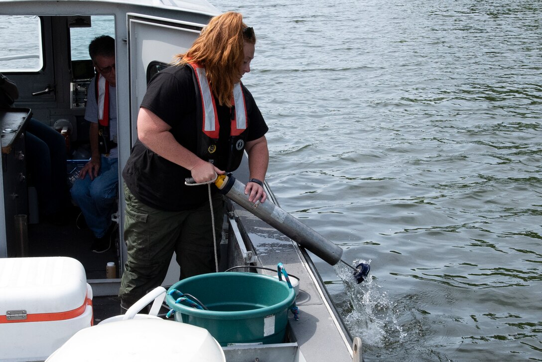 Sarah Pedrick, biologist in the U.S. Army Corps of Engineers Nashville District’s Water Management Section, releases water from a Kemmerer water sampler while checking water quality at Lake Cumberland in Kentucky May 25, 2022. (USACE Photo by Lee Roberts)