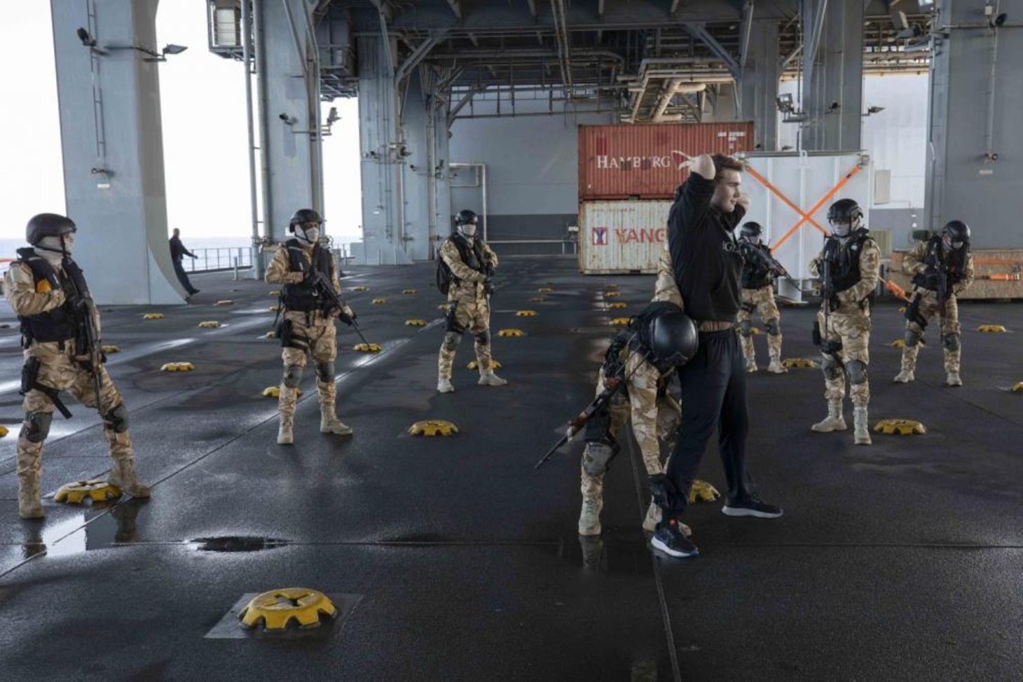 Mauritanian sailors conduct a personnel search on Aviation Ordnanceman Airman Dennis Davis, from Cedar Rapids, Iowa, during a visit, board, search and seizure drill aboard the Lewis B. Puller-class expeditionary sea base USS Hershel "Woody" Williams (ESB 4) as part of exercise Phoenix Express 22, May 29, 2022. Phoenix Express 22, conducted by U.S. Naval Forces Africa, is a maritime exercise designed to improve cooperation among participating nations in order to increase maritime safety and security in the Mediterranean.