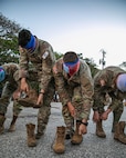 Blind folded soldiers take off boots