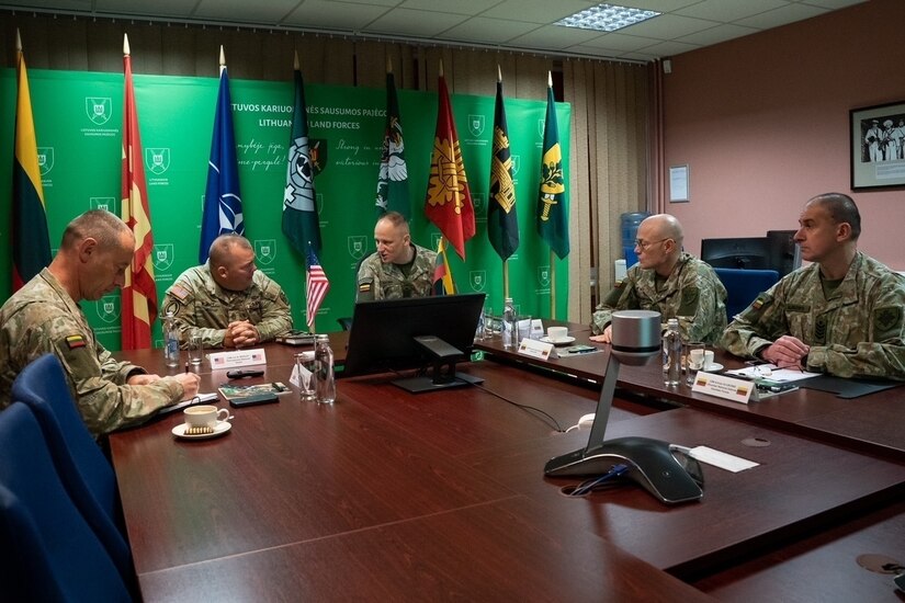 (Second from Left) Command Sgt. Maj. Jon Worley, Senior Enlisted Leader for the Pennsylvania National Guard, meets with Command Sgt. Maj. Remigijus Katinas, Sergeant Major of the Lithuanian Armed Forces, during a briefing on the professional military education requirements of the Lithuanian Armed Forces in Lithuania. The two senior noncommissioned officers were joined by other senior NCOS from Lithuania and the PA Guard to discuss the past accomplishments and future possible engagements between the PA Guard and Lithuanian Armed Forces.