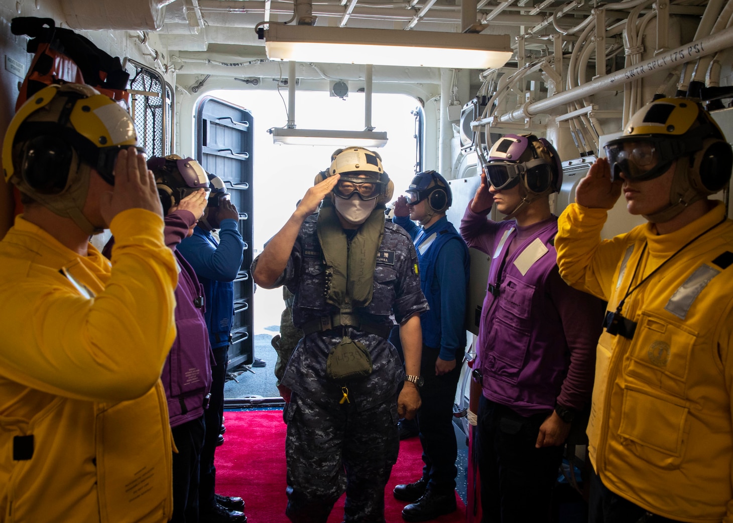 220603-N-TT639-1004 PACIFIC OCEAN (June 3, 2022) – Vice Adm. Hideki Yuasa, commander in chief, Self-Defense Fleet boards amphibious assault carrier USS Tripoli (LHA 7), June 3, 2022. Tripoli is operating in the U.S. 7th Fleet area of operations to enhance interoperability with allies and partners and serve as a ready response force to defend peace and maintain stability in the Indo-Pacific region.  (U.S. Navy photo by Mass Communication Specialist 3rd Class Christopher Sypert)