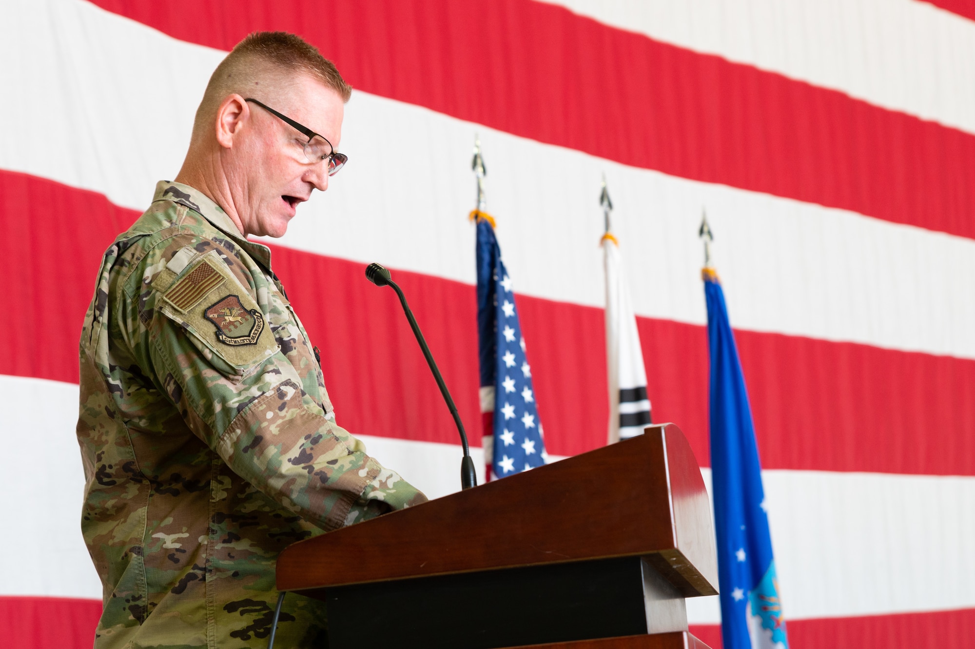 Col. Brian D. Moore, 51st Maintenance Group commander, recounts the achivements of the 51st Aircraft Maintnance Squadron before the deactivation order is executed