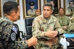 Salvadoran Defense Minister René Merino, left, and New Hampshire Adjutant Gen. David Mikolaities discuss the New Hampshire National Guard-El Salvador partnership under the Department of Defense National Guard Bureau State Partnership Program May 25, 2022, in San Salvador, El Salvador.