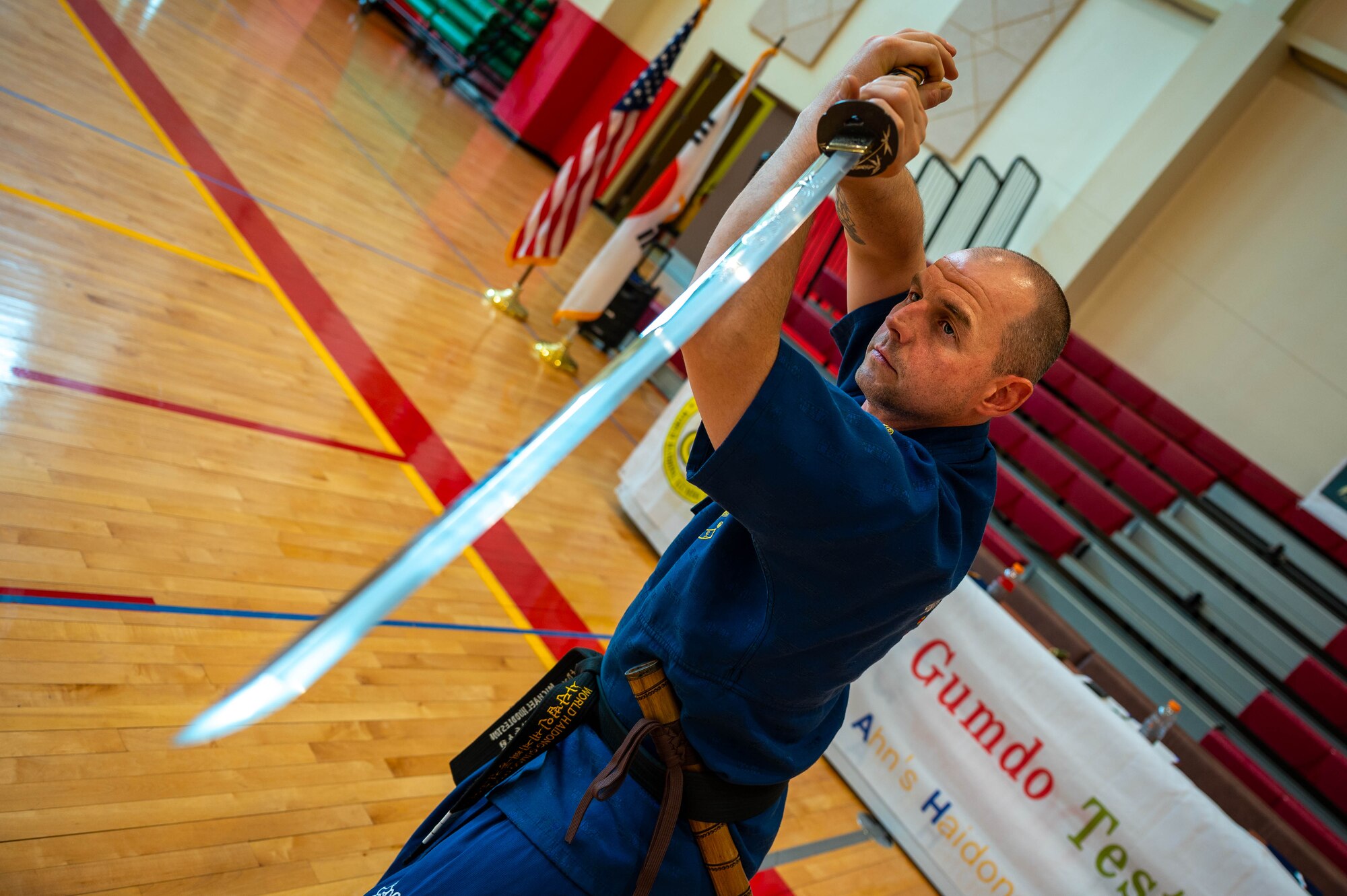 Sgt. 1st Class Michael Huddleston, 375th Ground Liaison Detachment non-commissioned officer in charge, poses with his sword