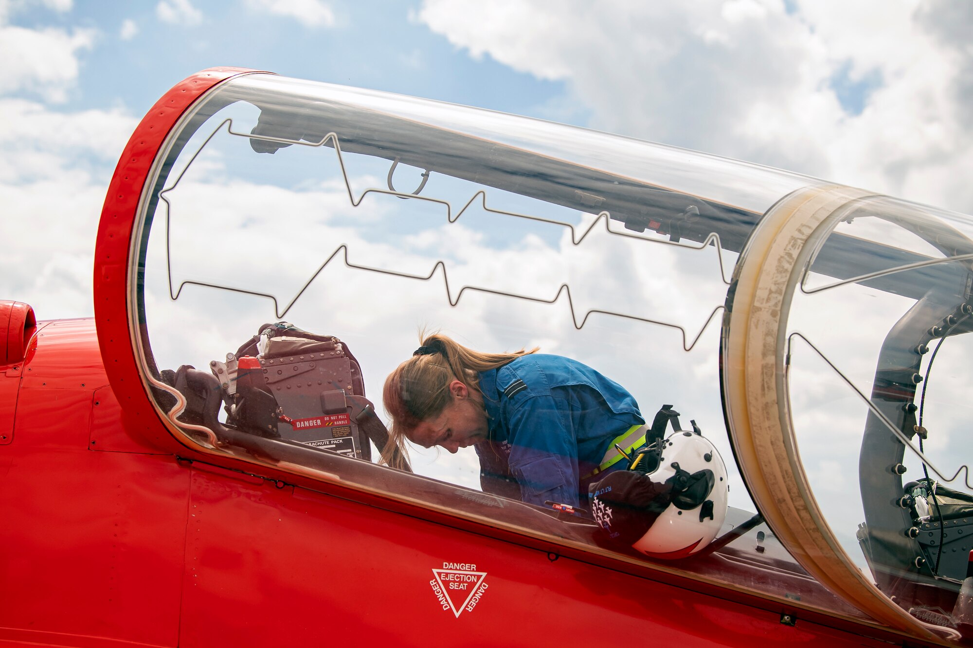 A member of The Royal Air Force aerobatic team, known as the Red Arrows, performs maintenance on a Hawk T1 aircraft at RAF Fairford, England, June 2, 2022. The Red Arrows landed at Fairford to refuel in preparation for the Queen’s Platinum Jubilee Ceremonies and Midlands Air Festival. (U.S. Air Force photo by Staff Sgt. Eugene Oliver)