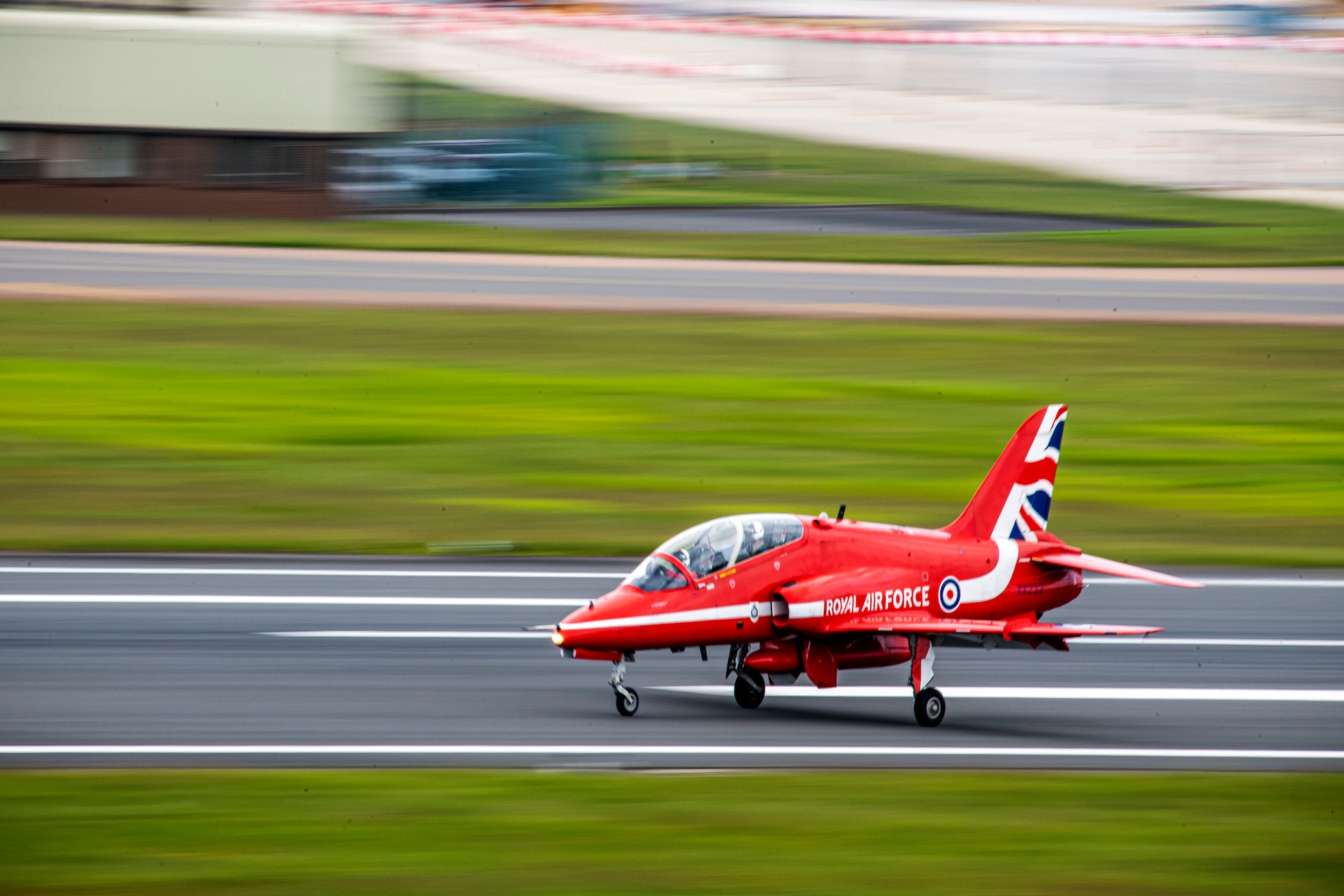 A Hawk T1 aircraft assigned to the Royal Air Force aerobatic team, known as the Red Arrows, lands on the runway at RAF Fairford, England, June 2, 2022. The Red Arrows landed at Fairford to refuel in preparation for the Queen’s Platinum Jubilee Ceremonies and Midlands Air Festival. (U.S. Air Force photo by Staff Sgt. Eugene Oliver)
