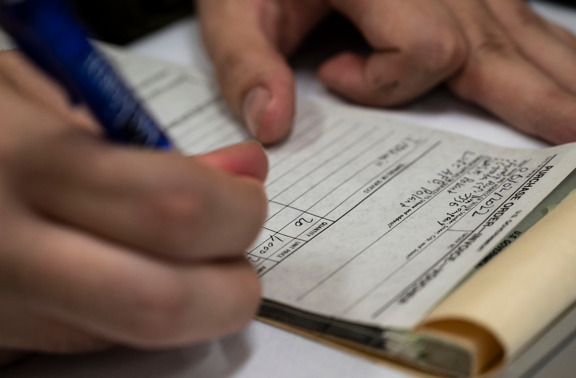 U.S. Air Force Senior Airman Christian Wiles, 47th Contracting Flight contract specialist, writes down information during a contingency contracting officer exercise June 2, 2022, at Laughlin Air Force Base, Texas.
