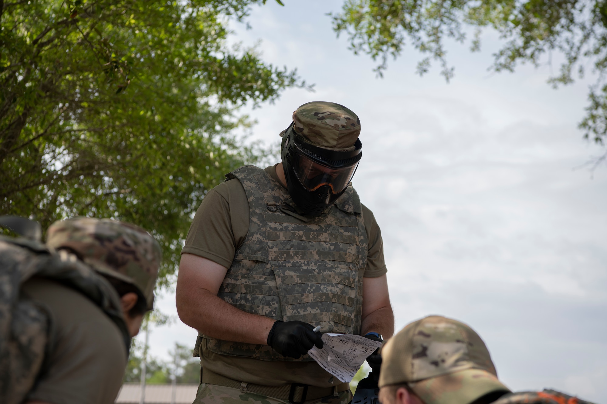 U.S. Air Force Staff Sgt. Austin Yentes, the 1st Special Operations Healthcare Operations Squadron information systems NCOIC, maintains a checklist during tactical combat casualty care training April 29, 2022, at Hurlburt Field, Florida.