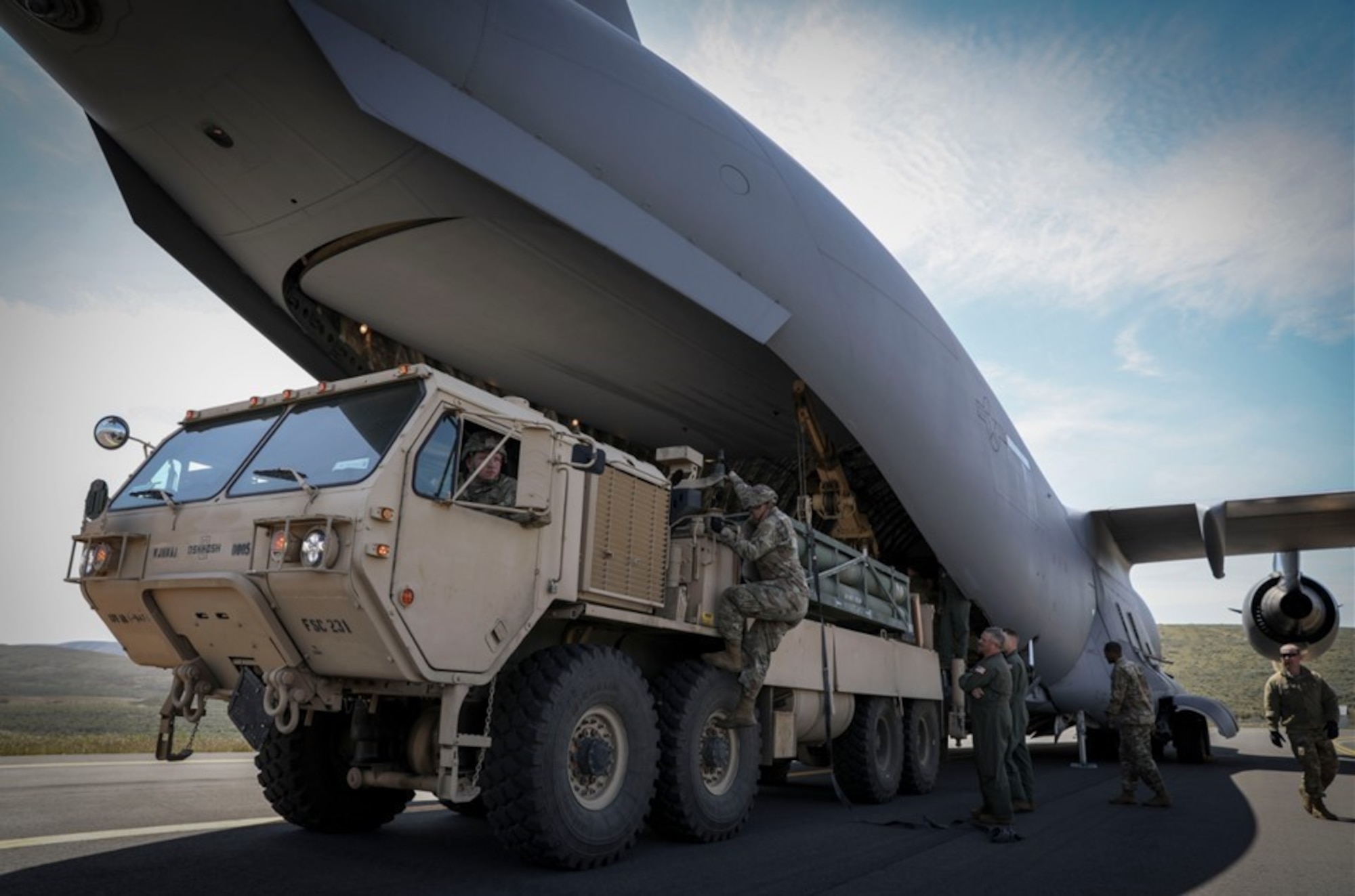 ‘Thunderbolt’ Soldiers unload ammunition from a C-17 Globemaster using a HIMARS Resupply Vehicle.
