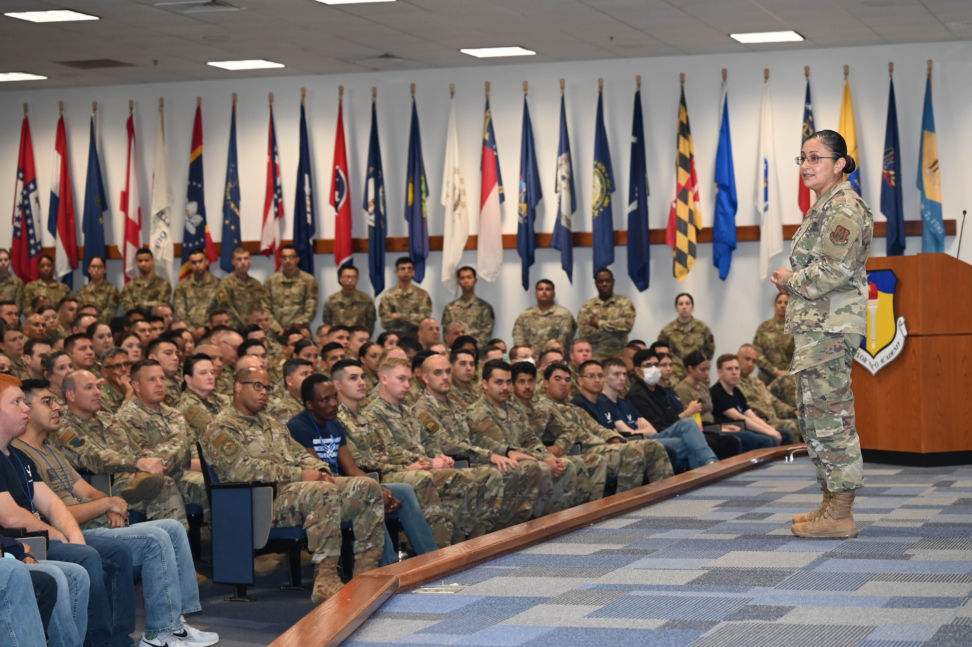 Chief Master Sgt. Cynthia Villa, 4th Air Force command chief, speaks to Reserve Citizen Airmen of the 433rd Airlift Wing during an enlisted all-call meeting at Joint Base San Antonio-Lackland, Texas, June 4, 2022. Villa answered questions on career advancement and the future of the Air Force. (U.S. Air Force photo by Senior Airman Brittany Wich)