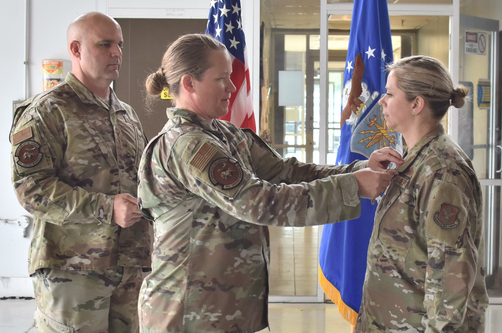 Lt. Col. Farrah Schluter, 301st Logistics Readiness Squadron commander, pins the Air Force Meritorious Service Medal onto Chief Master Sgt. Angela Rooney, 301 FW LRS senior enlisted leader, at Naval Air Station Joint Reserve Base Fort Worth, Texas on June 4, 2022. The Meritorious Service Medal is a decoration presented by the United States Armed Forces to recognize superior and exceptional non-combat service. (U.S. Air Force photo by Staff Sgt. Randall Moose)