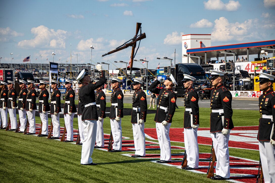Corporal Blake A. Behrens, number two rifle inspector, Silent Drill Platoon, conducts a rifle inspection at the pre-race ceremony during the Coca-Cola 600 at Charlotte Motor Speedway in Concord, N.C., May 28, 2022.