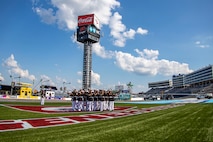 Marines with the Silent Drill Platoon execute their “bursting bomb” sequence at the pre-race ceremony during the Coca-Cola 600 at Charlotte Motor Speedway in Concord, N.C., May 28, 2022.