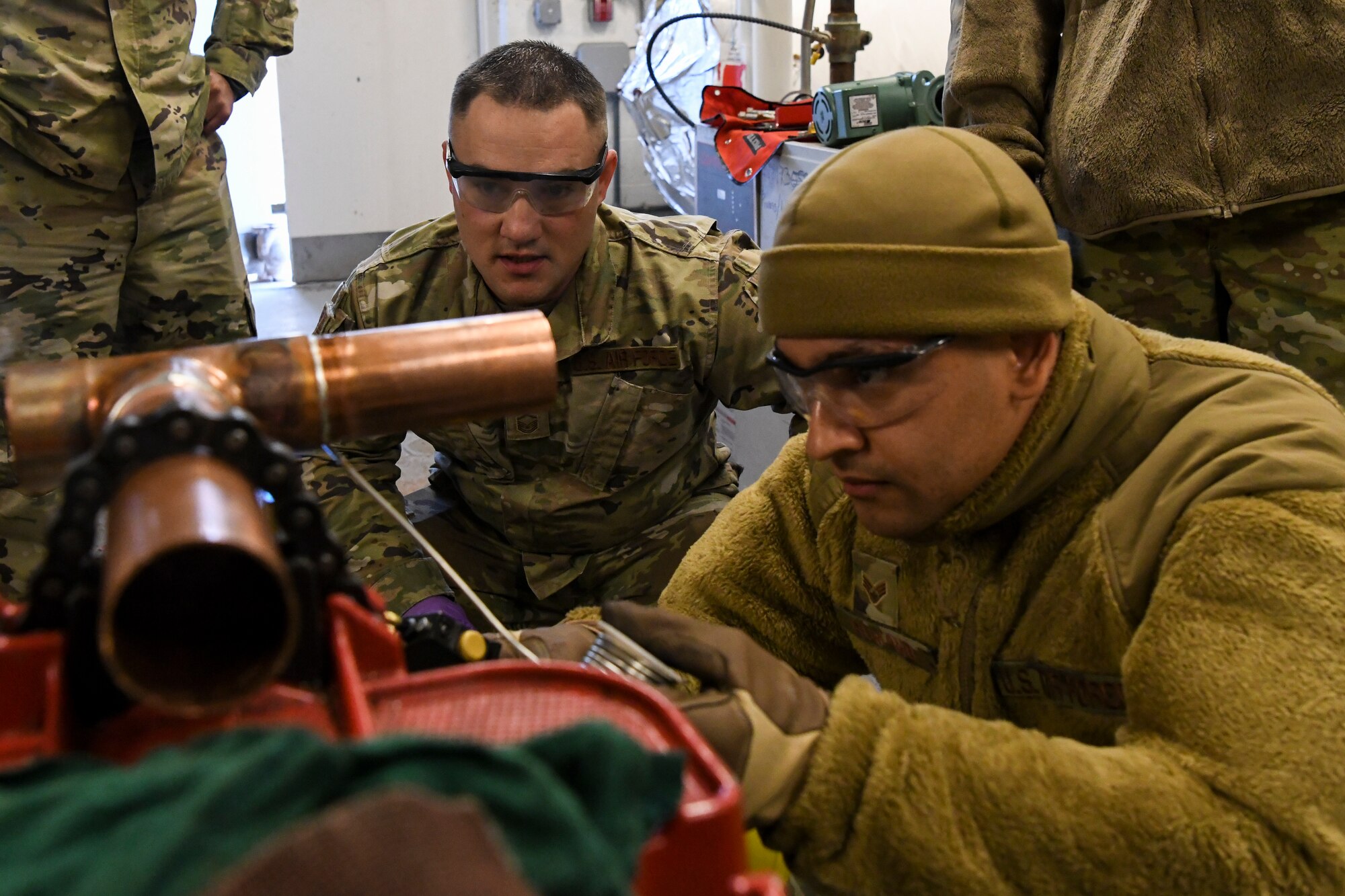 U.S. Air Force Master Sgt. Eric Cush, the operation supervisor, and Senior Airman David Romano, an HVAC technician, both of the 106th Rescue Wing, Francis S. Gabreski Air National Guard Base, Westhampton Beach, New York Air National Guard, prepare copper pipes to replace a broken water heater in the Services kitchen on base, March 5, 2022. The 106th Services kitchen operations were halted due to a broken water heater during the March drill until the 106th engineers replaced the water heater within two hours of notification.
(U.S. Air National Guard photo by Staff Sgt. Daniel Farrell)