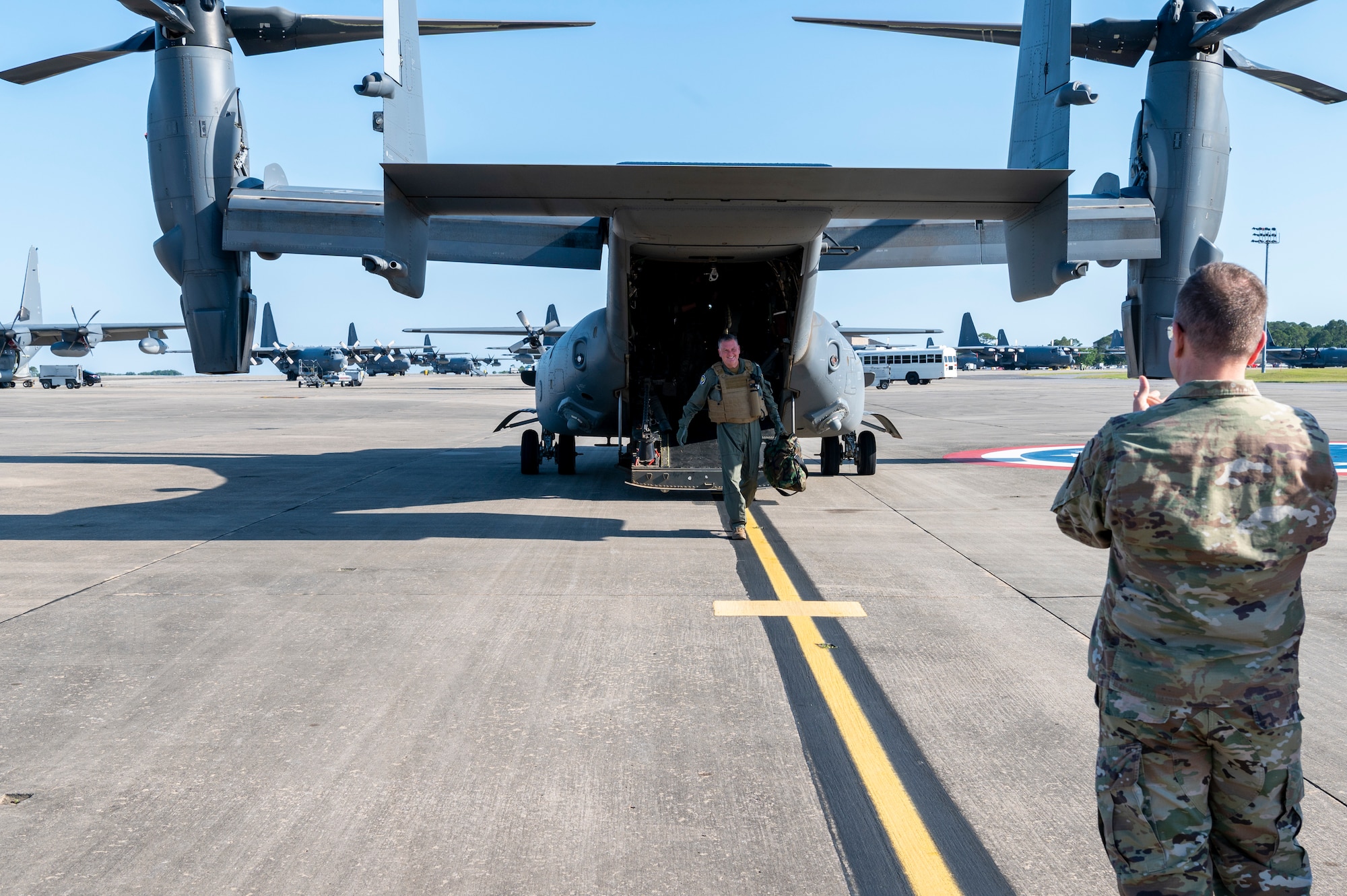 U.S. Air Force Lt. Gen. Brad Webb, commander of Air Education and Training Command, is greeted by Lt. Gen. Jim Slife, commander of Air Force Special Operations Command, after exiting a CV-22 Osprey following his fini-flight May 10, 2022 at Hurlburt Field, Fla.