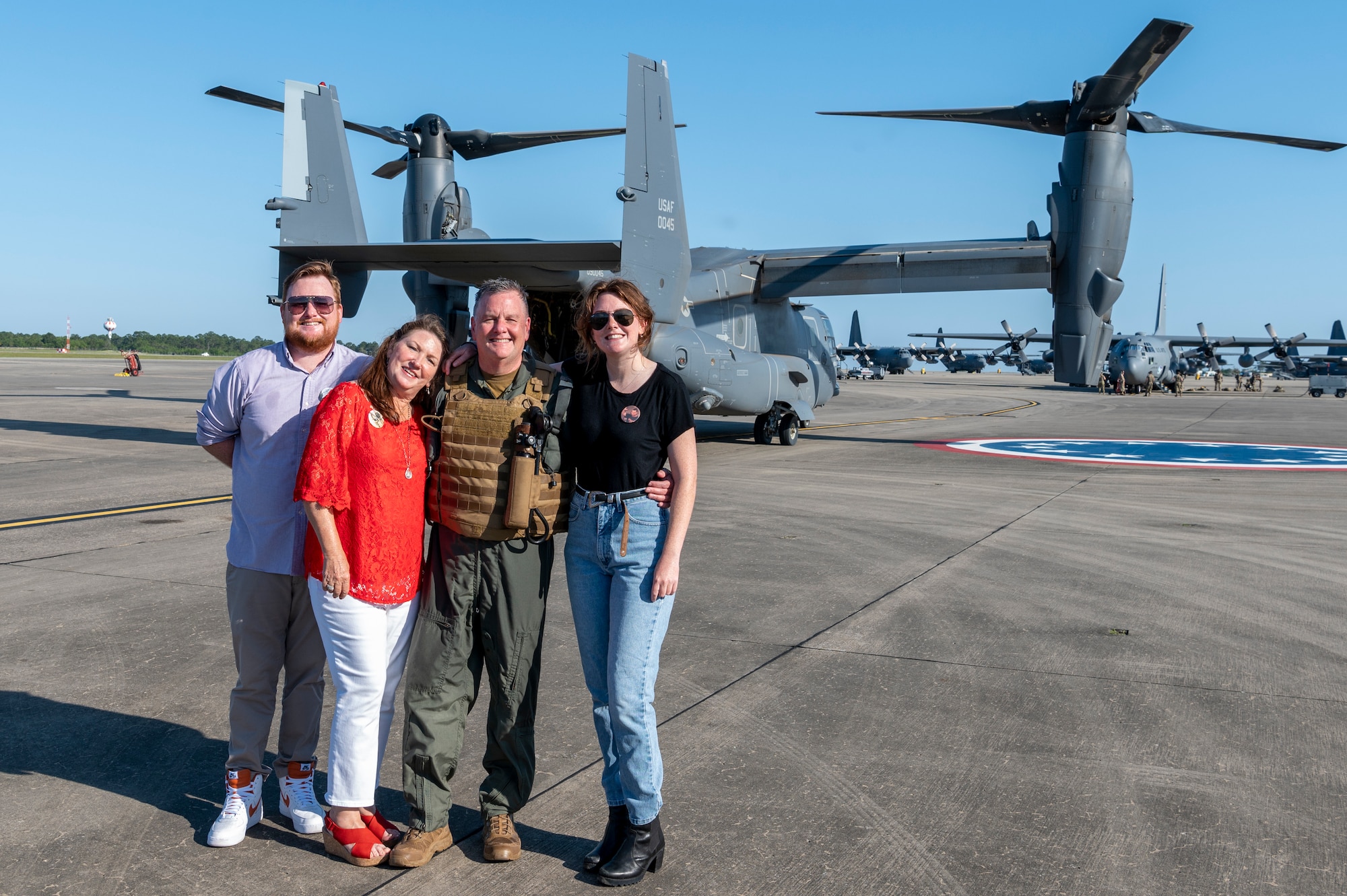 U.S. Air Force Lt. Gen. Brad Webb, commander of Air Education and Training Command, poses with his family in front of a CV-22 Osprey following his fini-flight May 10, 2022 at Hurlburt Field, Fla.