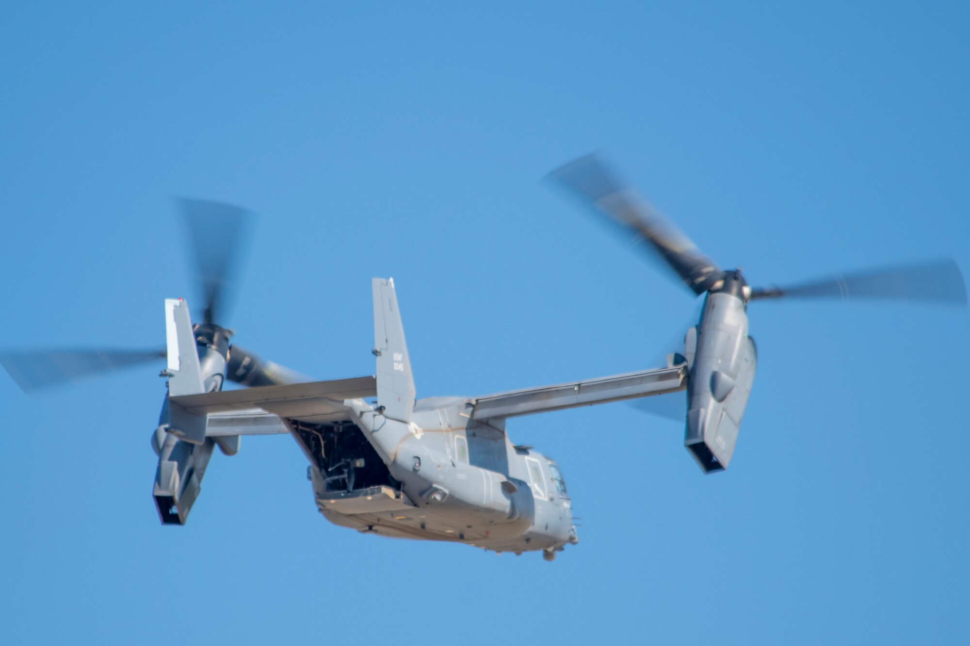 U.S. Air Force Lt. Gen. Brad Webb, commander of Air Education and Training Command, hovers above the flight line in a CV-22 Osprey May 10, 2022, at Hurlburt Field, Fla.