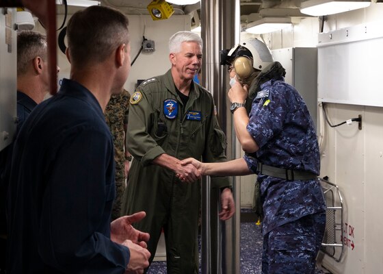 220603-N-TT639-1013 PACIFIC OCEAN (June 3, 2022) – Vice Adm. Karl Thomas commander, U.S. 7th Fleet, left, greets Vice Adm. Hideki Yuasa, commander in chief, Self-Defense Fleet aboard amphibious assault carrier USS Tripoli (LHA 7), June 3, 2022. Tripoli is operating in the U.S. 7th Fleet area of operations to enhance interoperability with allies and partners and serve as a ready response force to defend peace and maintain stability in the Indo-Pacific region.  (U.S. Navy photo by Mass Communication Specialist 3rd Class Christopher Sypert)