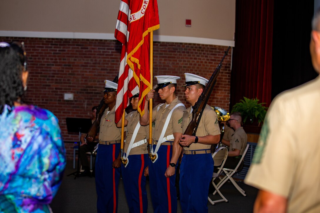 Marine Corps Air Station (MCAS) Cherry Point Color Guard prepares to present the Marine Corps Flag during the 46th Annual Voluntary Education Graduation Ceremony at Two Rivers Theatre, MCAS Cherry Point, North Carolina, June 2, 2022. The goals of the voluntary education programs are to provide a broad range of personal and professional learning opportunities to improve the academic abilities of active-duty personnel to assist in their career progression and to generally strengthen the military community. (U.S. Marine Corps photo by Lance Cpl. Symira Bostic)