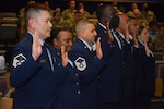 433rd Airlift Wing master sergeants raise their right hands to recite the Senior Noncommissioned Officer Oath during the SNCO Induction Ceremony at Joint Base San Antonio-Lackland, Texas, June 4, 2022. Chief Master Sgt. Cynthia Villa, 4th Air Force command chief, served as the ceremony’s guest speaker during her visit to the wing. (U.S. Air Force photo by Tech. Sgt. Mike Lahrman)