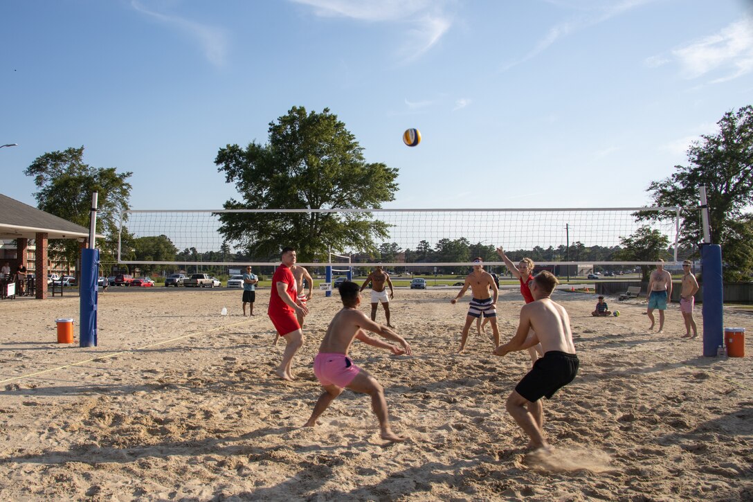 A volleyball sails onto the Red Bulls side of the court during the championship game for the Top Gun Maverick: Madness Volleyball Tournament at the Roadhouse, Marine Corps Air Station Cherry Point, North Carolina, May 20, 2022. Marine Corps Community Services held a volleyball tournament to foster unit moral and friendly competition. The winners of the competition received seats to a sneak-peek of Top Gun: Maverick. (U.S. Marine Corps photo by Sgt. Christian J. Lopez)