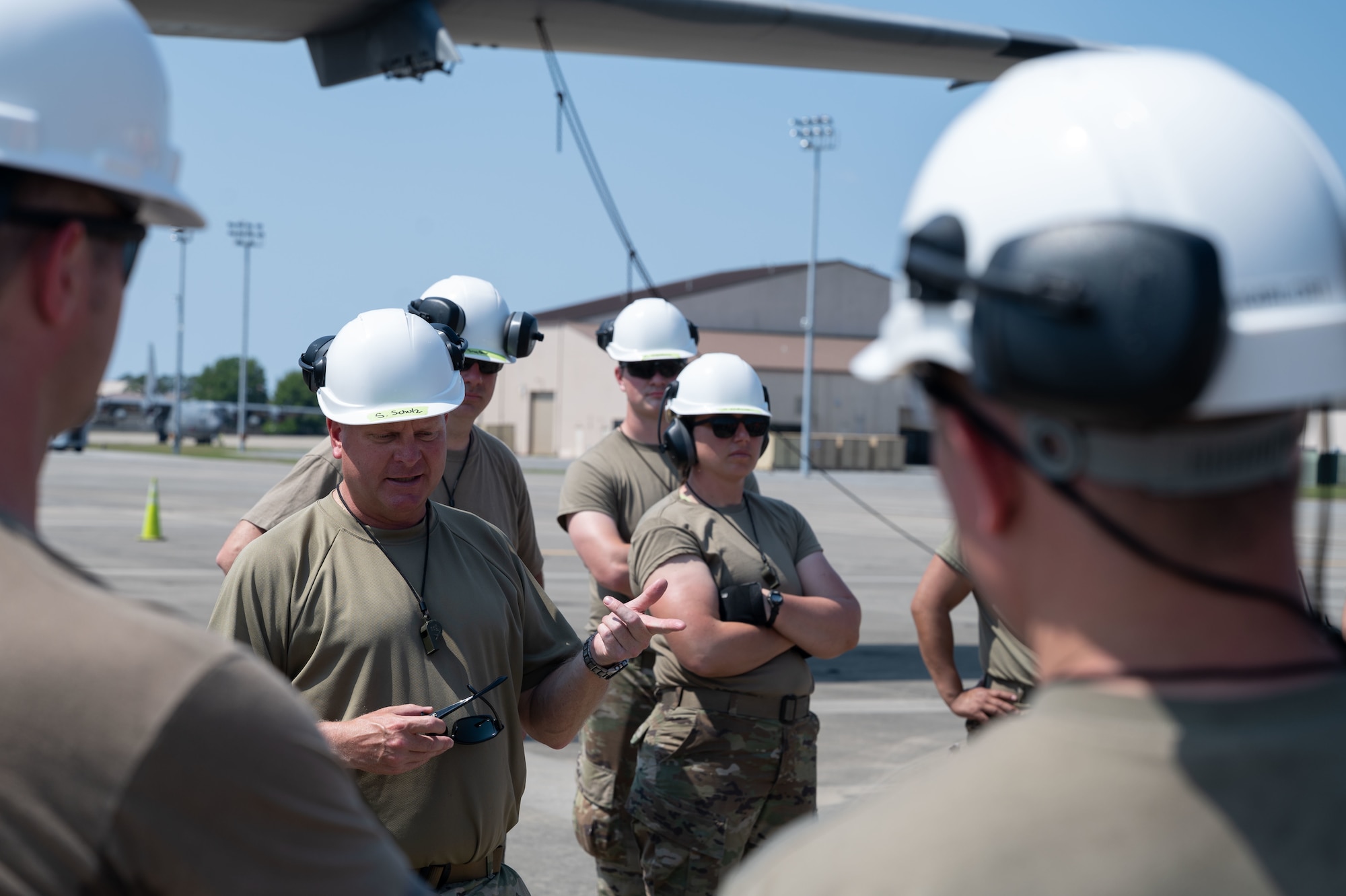 U.S. Air Force Senior Master Sgt. Spencer Schulz, a Pennsylvania Air National Guard, 193rd Special Operations Wing, propulsion flight chief, debriefs airmen from Pennsylvania Air National Guard’s 193rd Special Operations Wing and 1st Special Operations Maintenance Squadron after a joint training event on May 17, 2022, at Hurlburt Field, Florida.