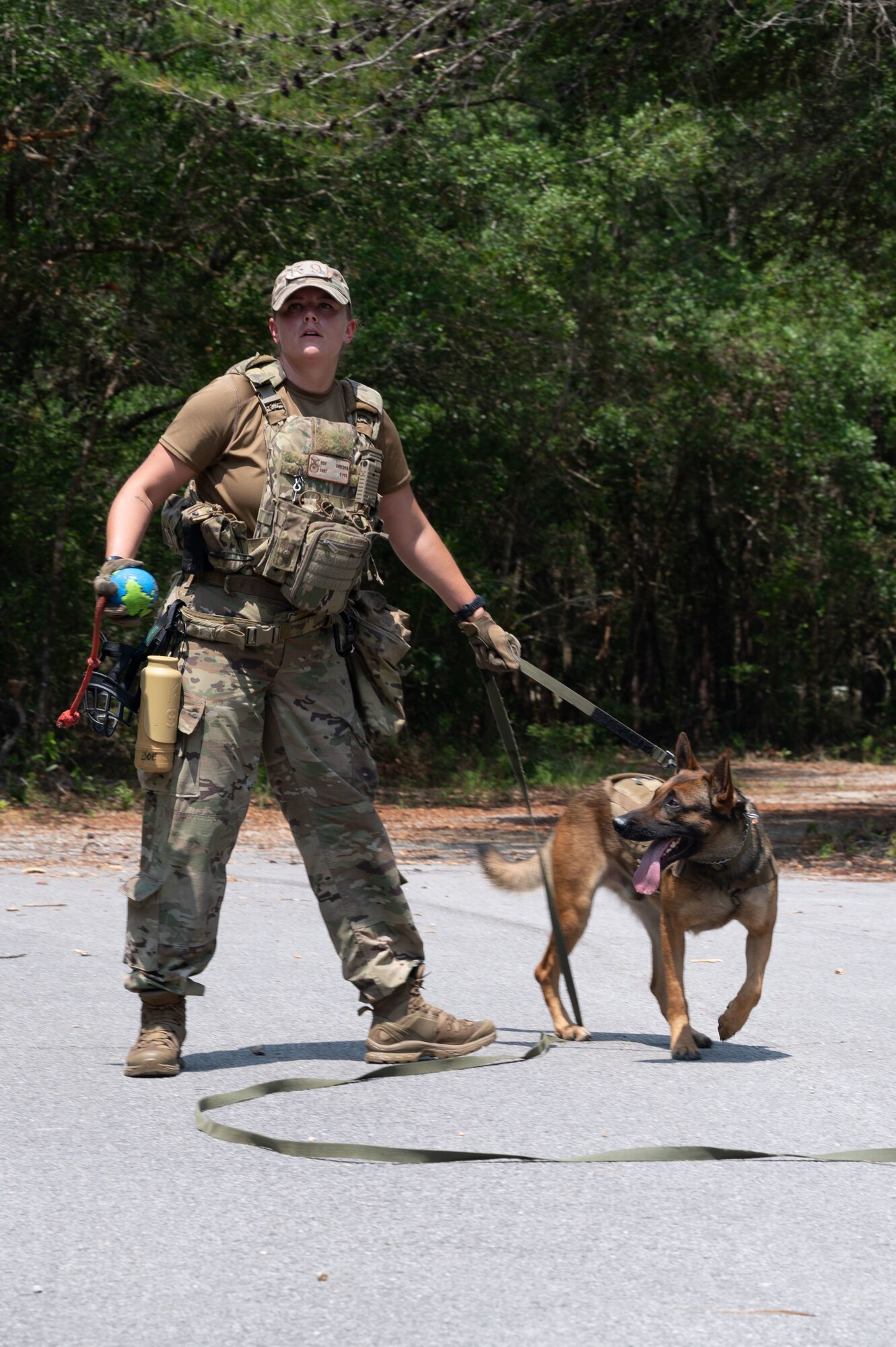 U.S. Air Force Staff Sgt. Chelsea Boe, a military working dog handler from Eglin Air Force Base, competes in a K9 competition during National Police Week on May 18, 2022, at Eglin Air Force Base.