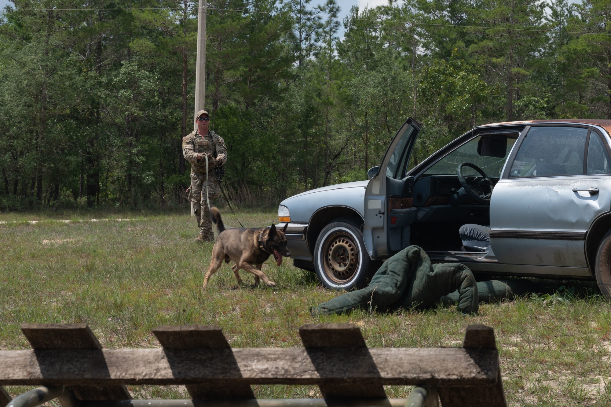 U.S. Air Force Staff Sgt. Thomas Cullen, a military working dog handler from Tyndall Air Force Base, competes in a K9 competition during National Police Week on May 18, 2022, at Eglin Air Force Base