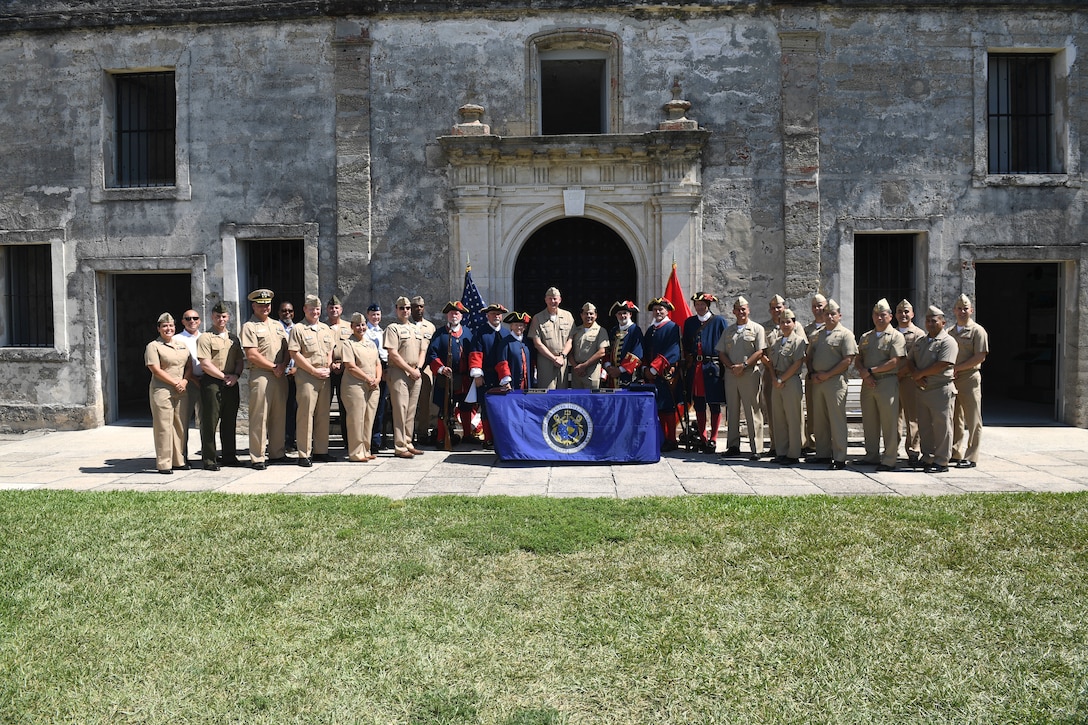 U.S. Navy personnel pose for a group photo alongside sailors from the Peruvian navy, U.S. Coast Guard, U.S. Marine Corps, actors from the 18th century Spanish colonial era, and other distinguished guests at the Castillo de San Marcos National Monument during the closing ceremony of the 28th annual Maritime Staff Talks (MST), June 3, 2022. MSTs support the U.S. maritime strategy by building and strengthening working relationships with U.S. and partner nations.
