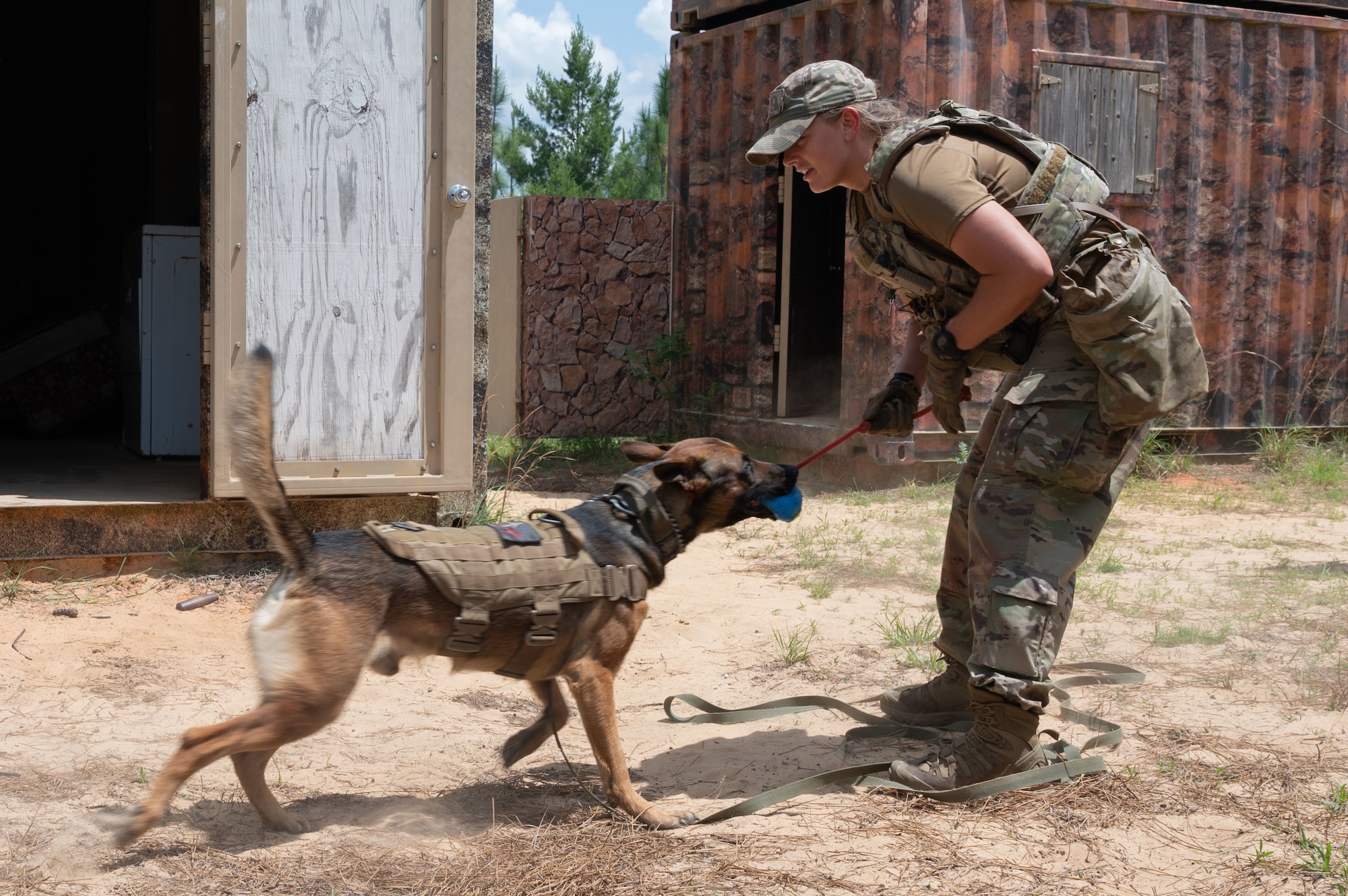 U.S. Air Force Staff Sgt. Chelsea Boe, a military working dog handler from Eglin Air Force Base, competes in a K9 competition during National Police Week on May 18, 2022, at Eglin Air Force Base.