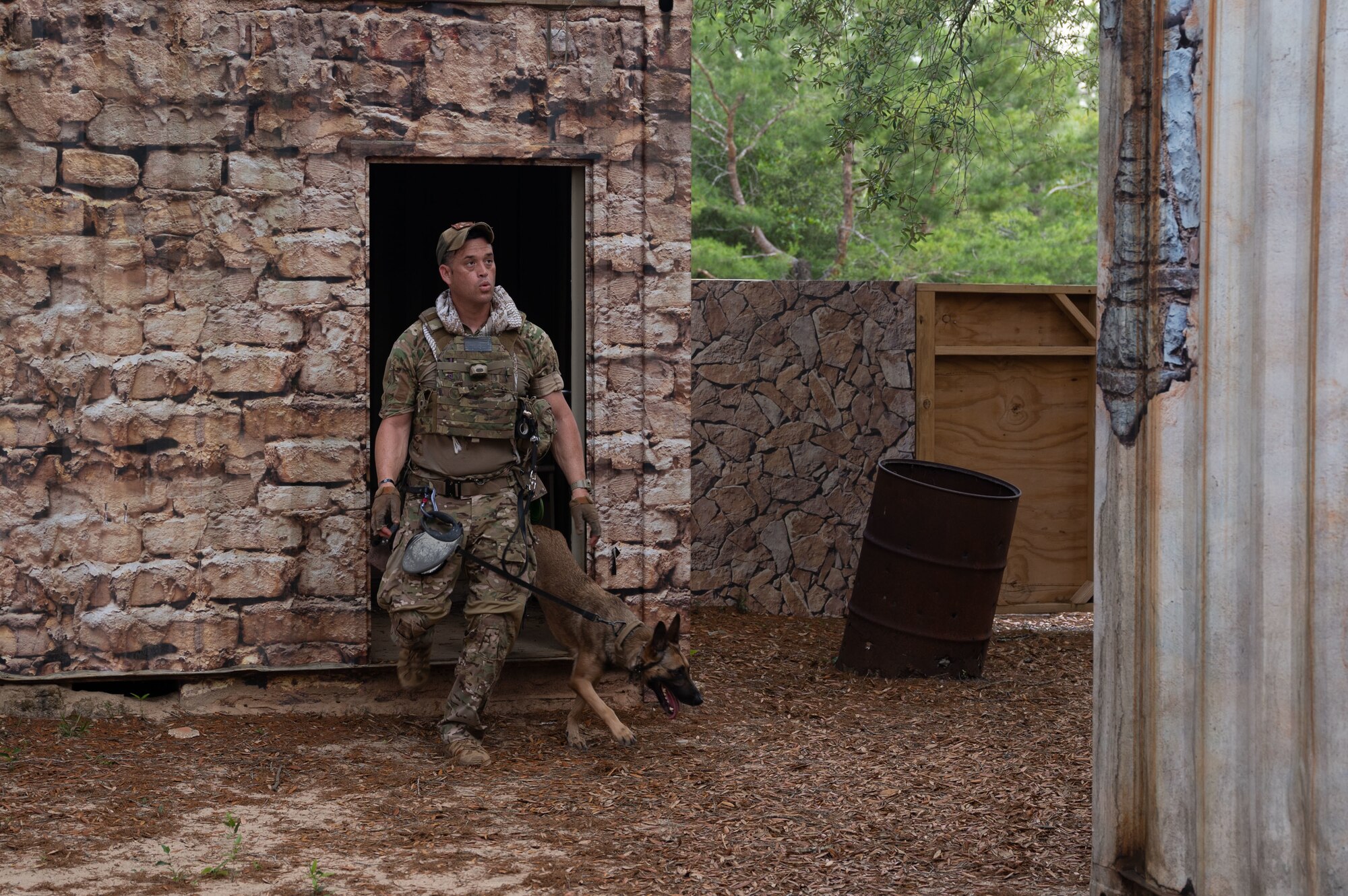 U.S. Air Force Master Sgt. Brandon Ouderkirk, a military working dog handler from Moody Air Force Base, competes in a K9 competition during National Police Week on May 18, 2022, at Eglin Air Force Base