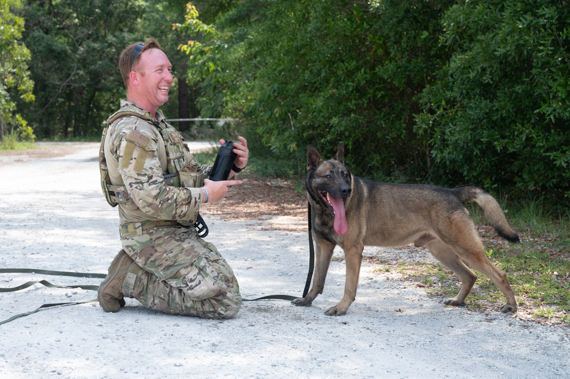 U.S. Air Force Staff Sgt. Thomas Cullen, a military working dog handler from Tyndall Air Force Base, competes in a K9 competition during National Police Week on May 18, 2022, at Eglin Air Force Base.