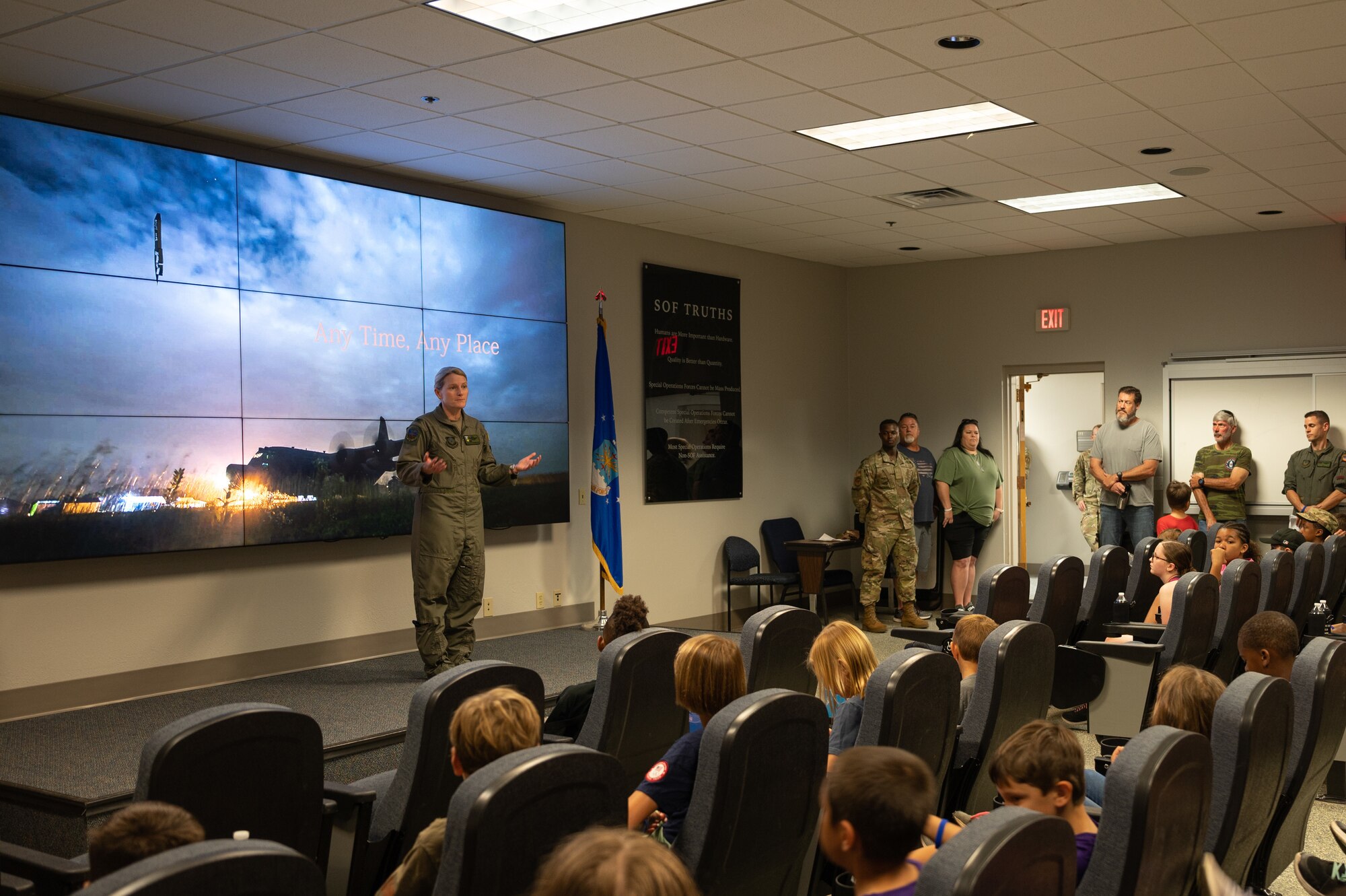 U.S. Air Force Col. Jocelyn J. Schermerhorn, commander of the 1st special operations wing, briefs children taking part in Kids Understanding Deployment Operations April 30, 2022, at Hurlburt Field, Florida.