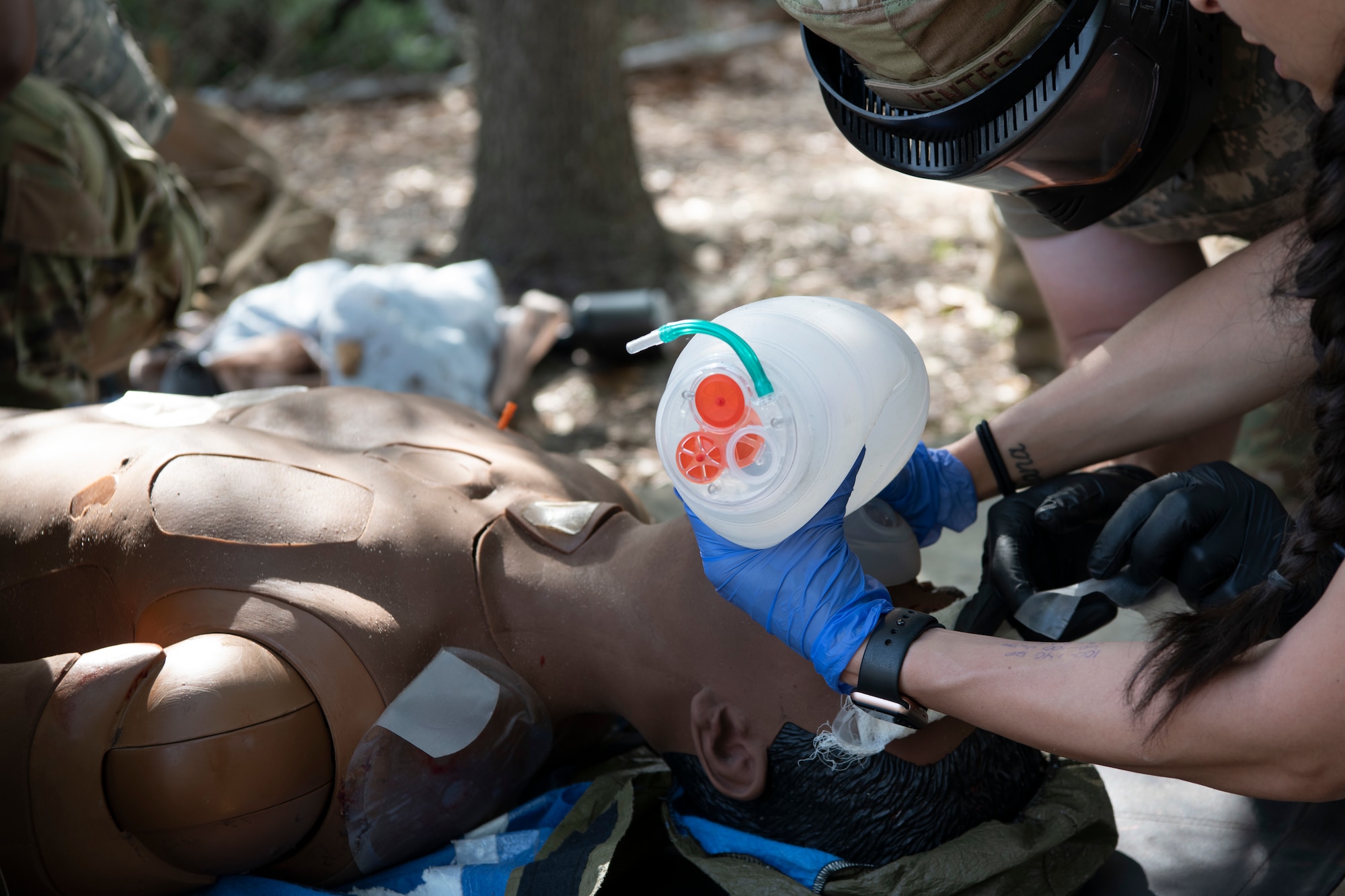 Air Commandos with the 1st Special Operations Healthcare Operations Squadron and the 1st Special Operations Medical Group provide rescue breathing for a SIM manikin during a tactical combat casualty care training April 29, 2022, at Hurlburt Field, Florida.
