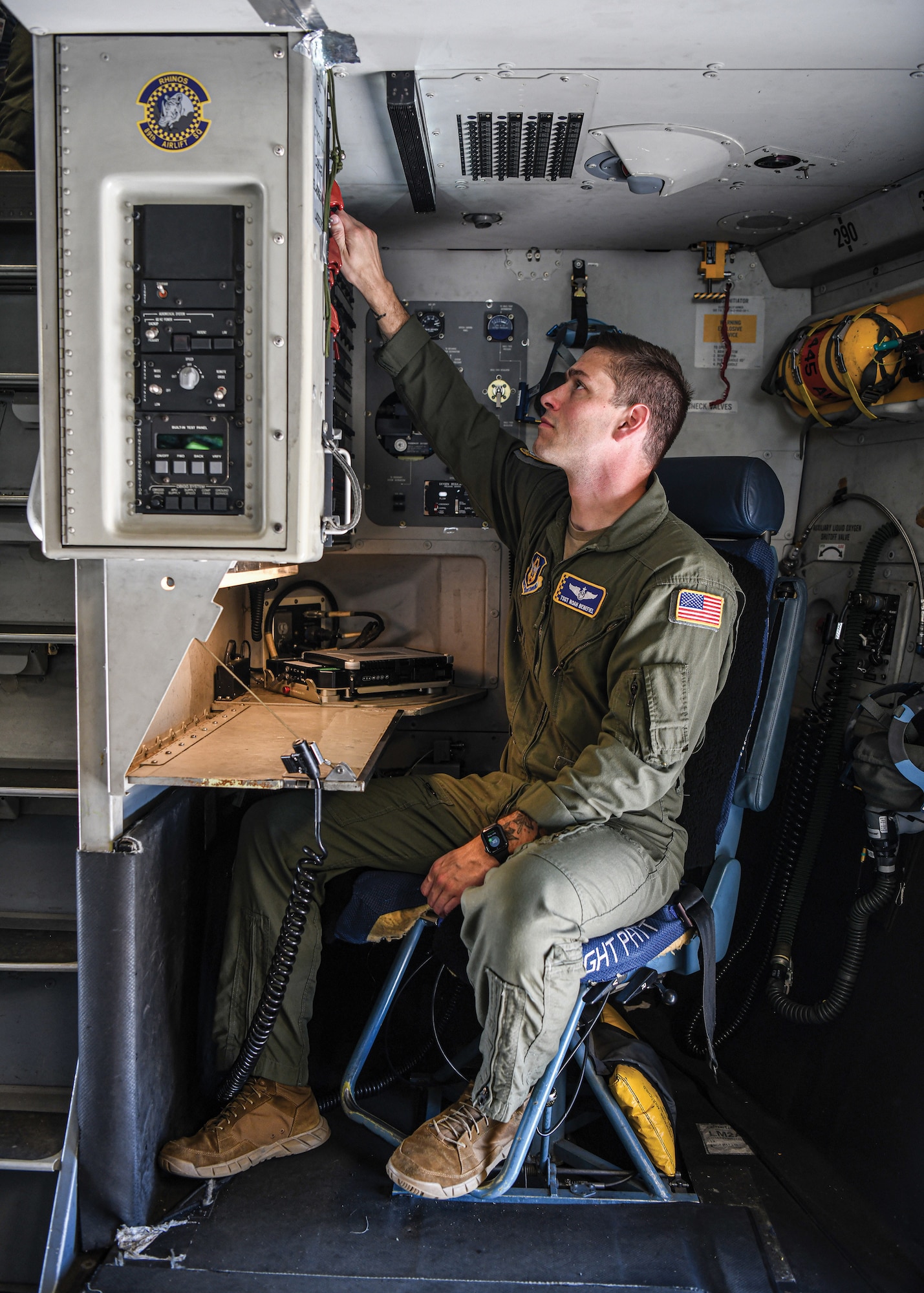 ch. Sgt. Noah Benefiel, 89th Airlift Squadron instructor loadmaster, performs duties at the loadmaster station on a C-17 Globemaster III May 13, 2022.