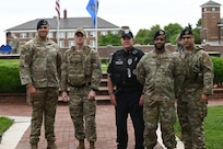 11th Security Forces Squadron members assigned to Joint Base Anacostia-Bolling stand for a group photo on the Ceremonial Lawn at JBAB, May 16, 2022. The 11th SFS held an opening ceremony to commence National Police Week, an observance to honor law enforcement officers that were killed or disabled in the line of duty. (U.S. Air Force photo by Airman 1st Class Anna Smith)