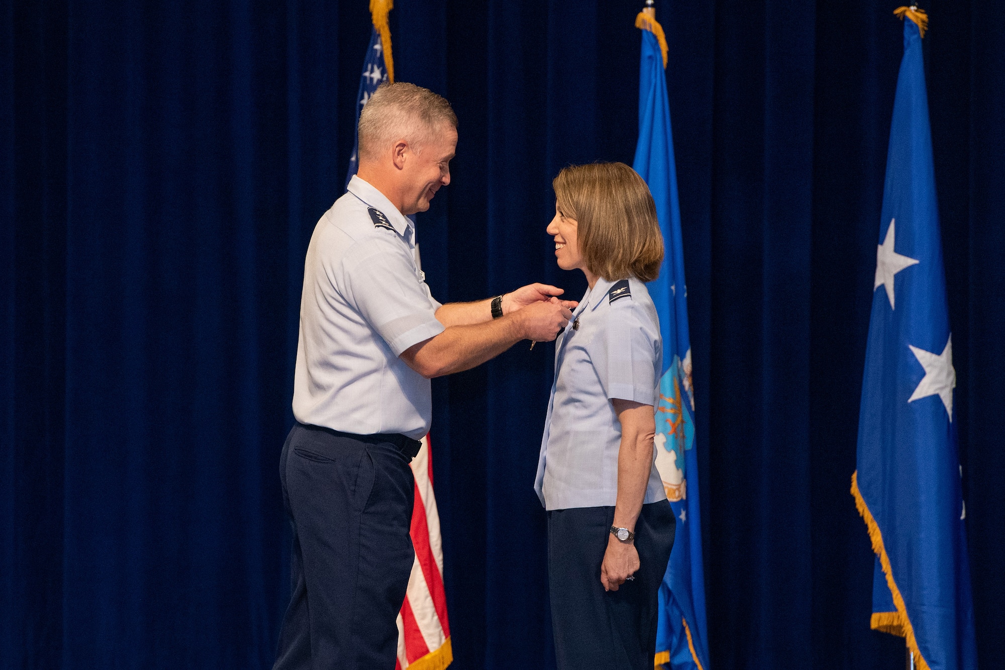 Lt. Gen. Timothy Haugh, commander of 16th Air Force, presents the Legion of Merit medal to Col. Katharine Branson during the Air Force Technical Applications Center's change of command ceremony June 2, 2022 at Patrick Space Force Base, Fla.  (U.S. Air Force photo by Amanda Inman)