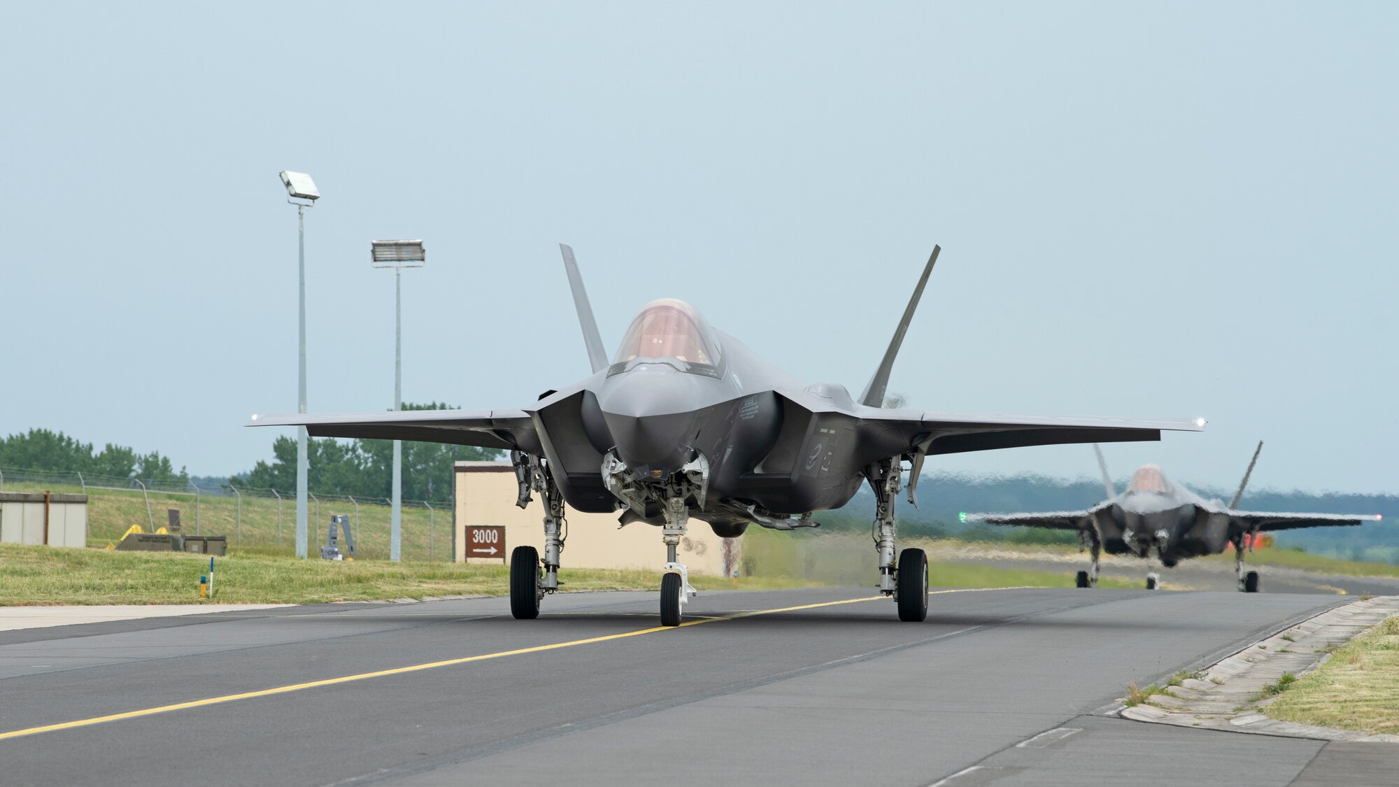 Two F-35A Lightning II aircraft assigned to the 315th Fighter Squadron taxi at Spangdahlem Air Base, Germany, June 3, 2022. Airmen from the Vermont Air National Guard's 158th Fighter Wing are deployed to Spangdahlem in support of NATO's air policing mission. (U.S. Air Force photo by Tech. Sgt. Anthony Plyler)