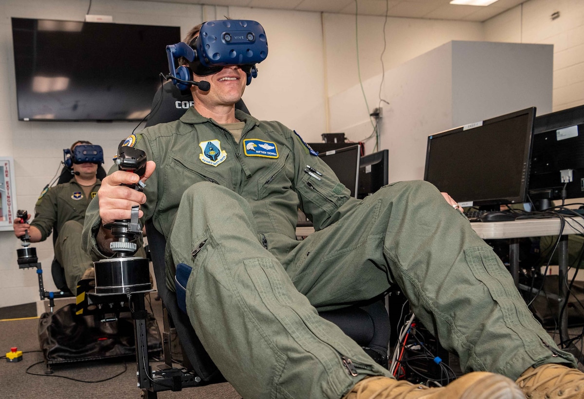 Col. Matthew Crowell, the Air Force Safety Center’s chief of aviation safety; and Capt. Phillip Butler, 314th Fighter Squadron, operate their virtual aircraft at AFRL’s Directed Energy and Kinetic Energy Directed Energy Concept Utility Experiment, or DEKE DEUCE, held at Kirtland Air Force Base, New Mexico. (U.S. Air Force photo / Allen Winston)