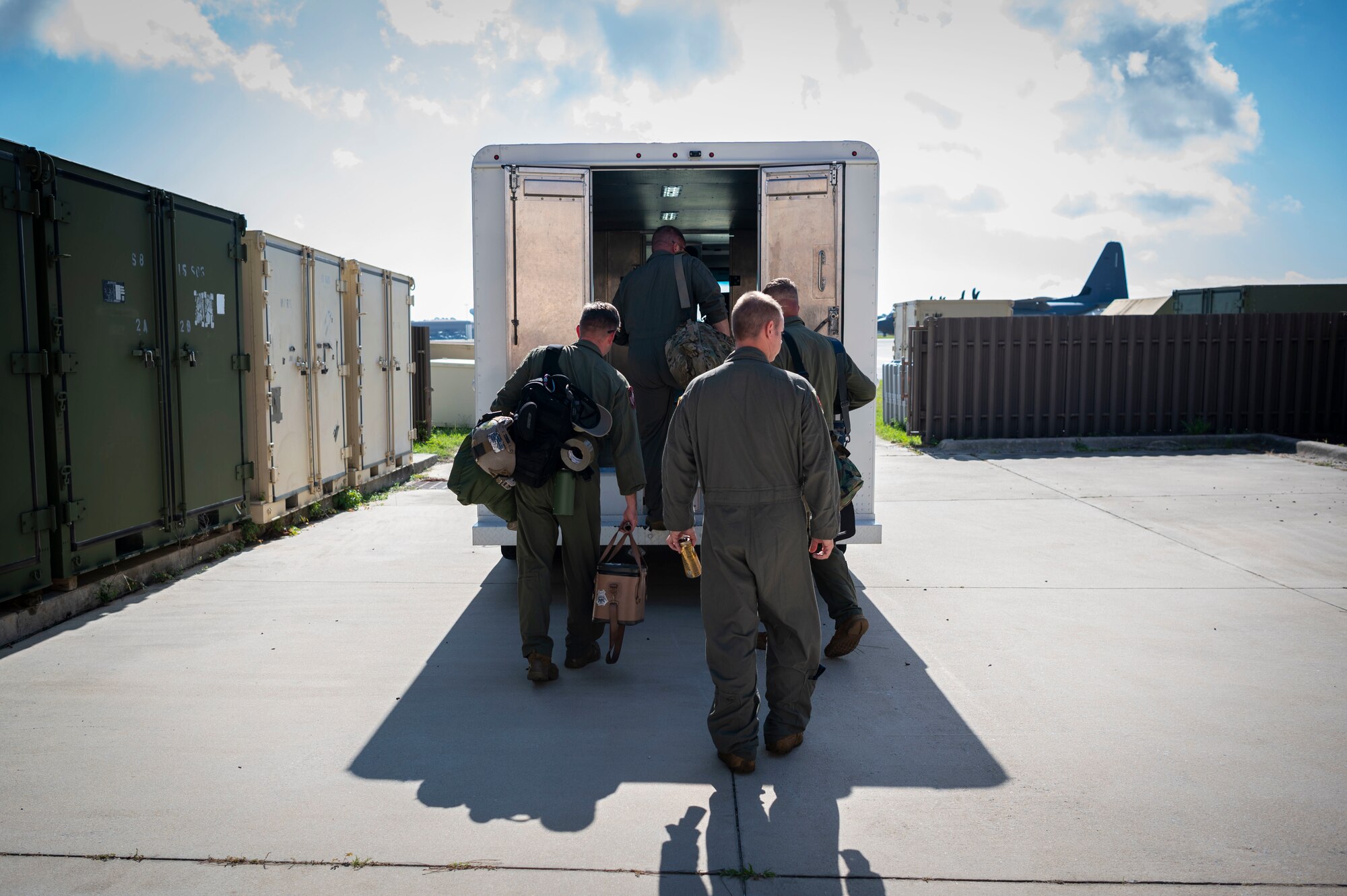 Air Commandos load into a bus to be taken to an MC-130H Combat Talon II, at Hurlburt Field, Florida, May 31, 2022.
