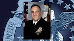 Portrait of Navy Lt. Cmdr. Hugh Wilson on DLA background.